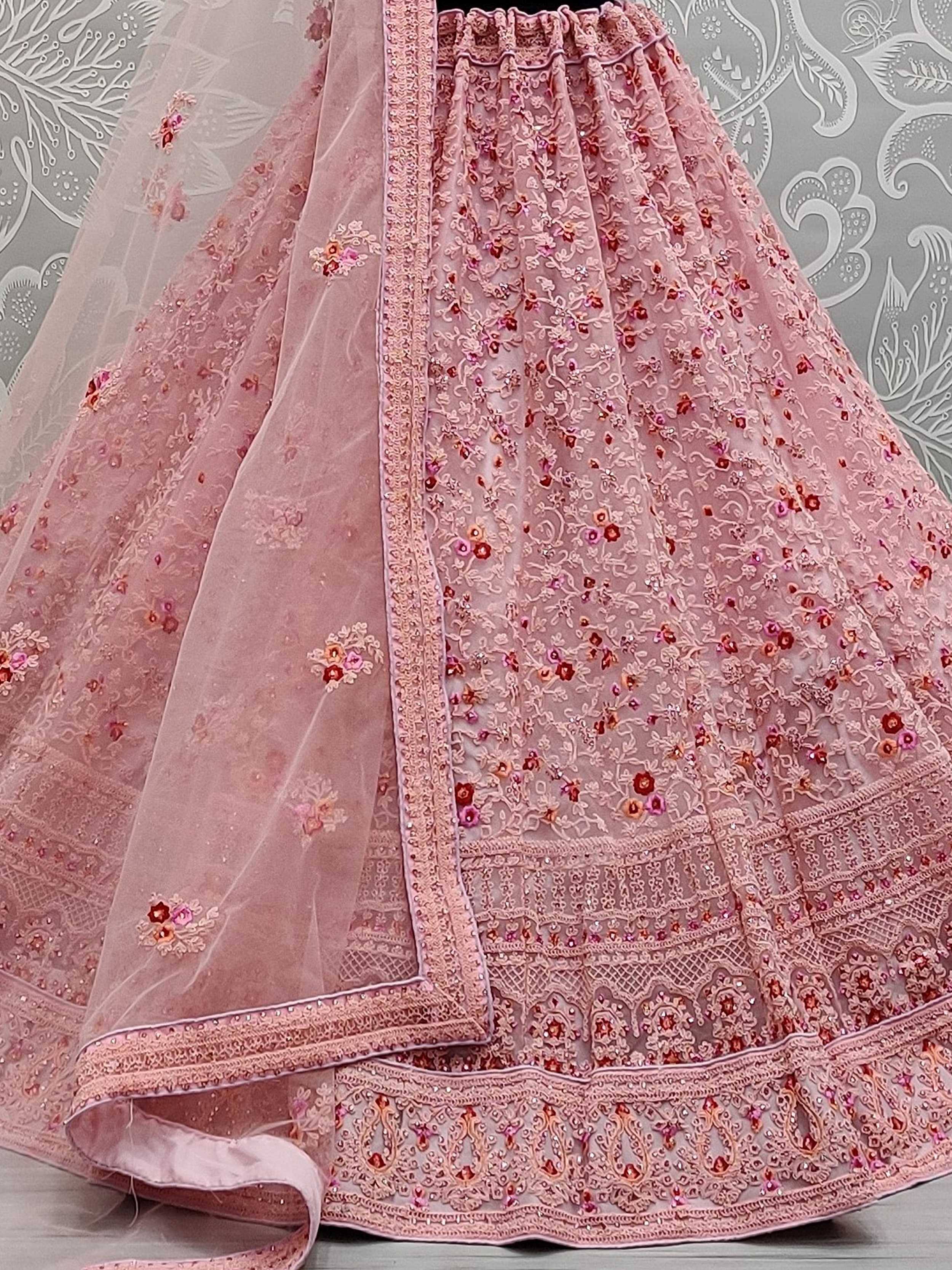 Pink embroidered lehenga choli with floral motifs and lace detailing