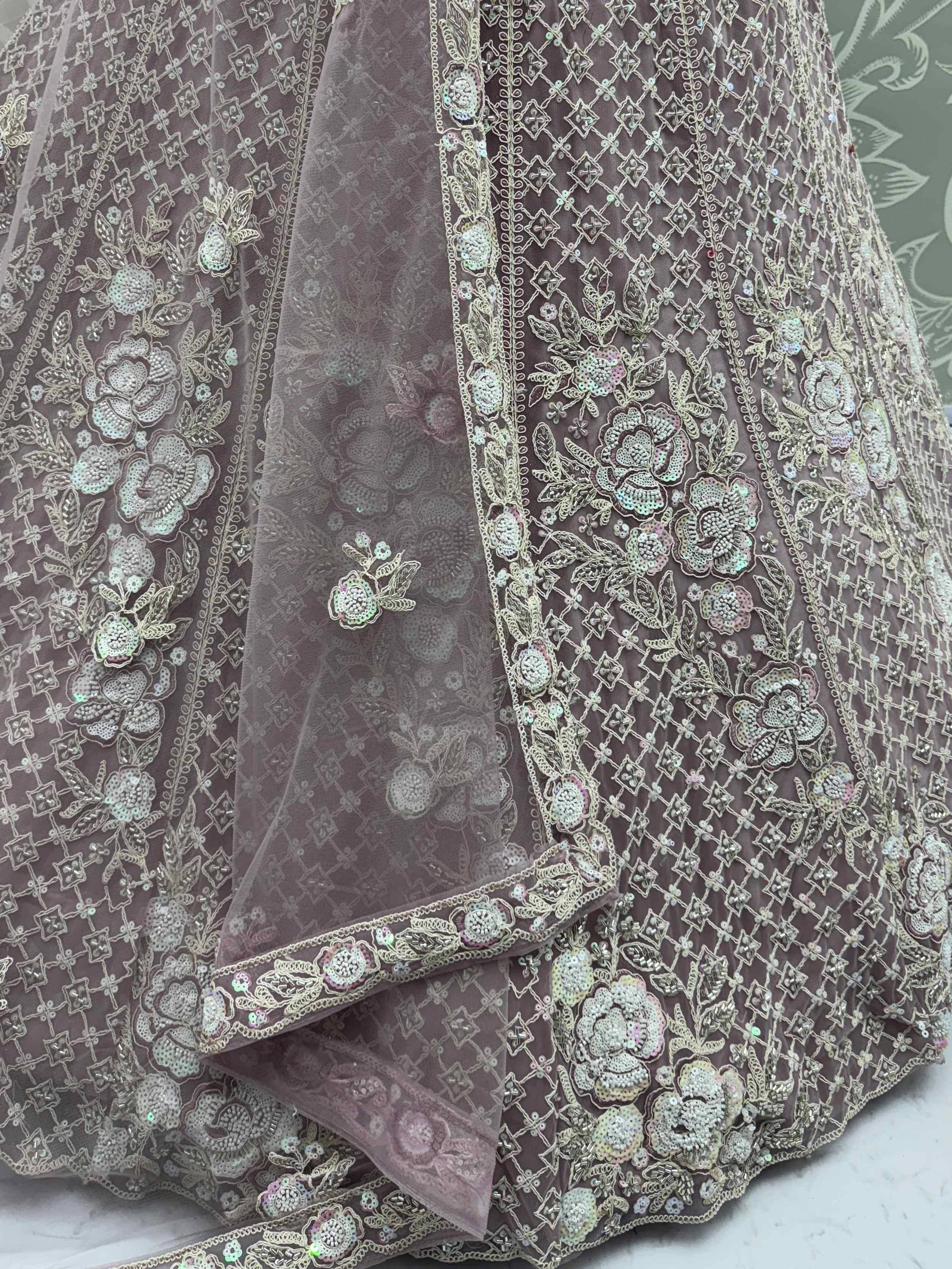 Elegant grey lehenga choli with floral sequin embroidery and net dupatta, perfect for Indian ethnic wear.