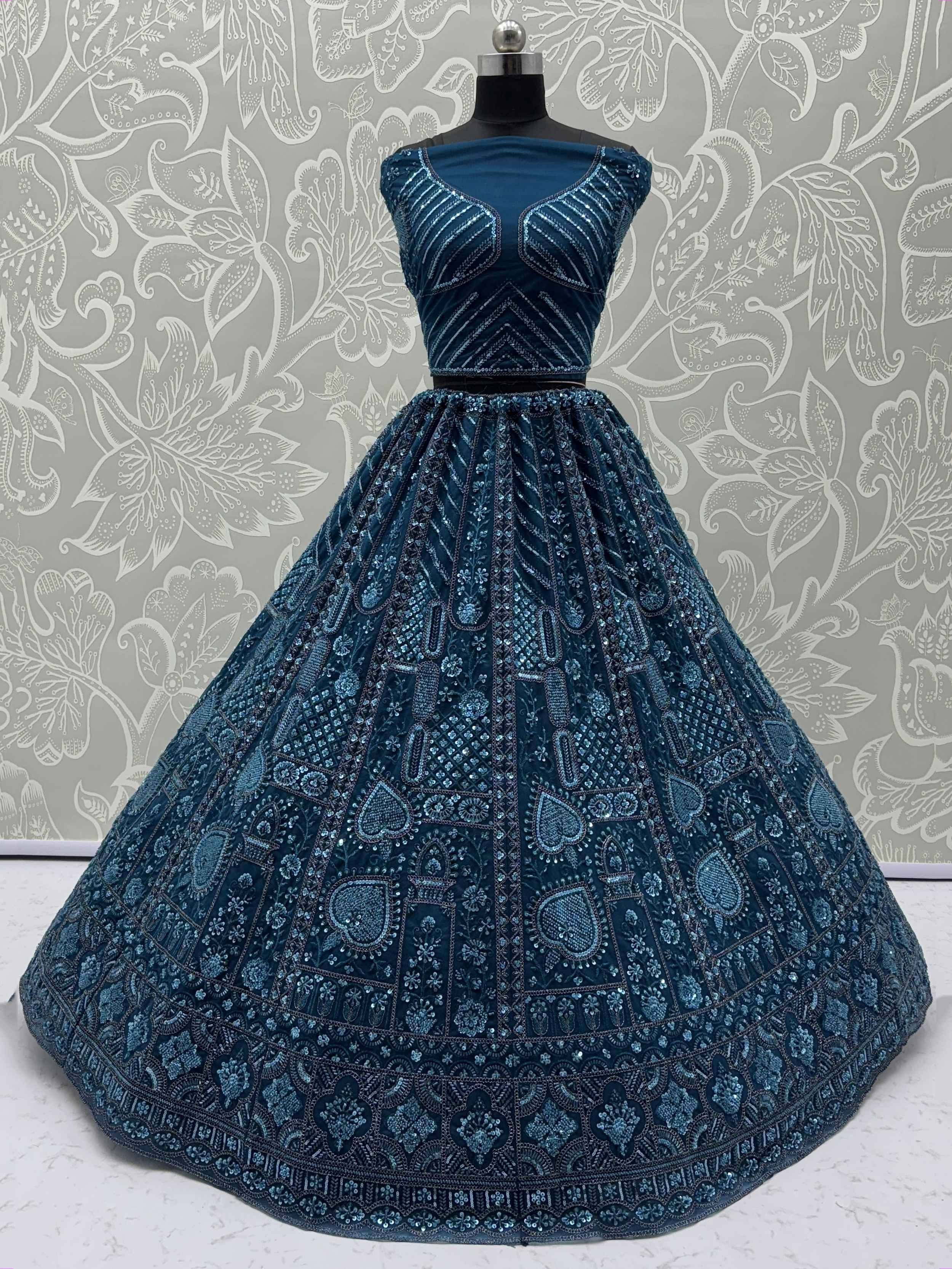 Teal blue designer lehenga choli with intricate sequin embroidery, perfect for Indian ethnic wear events.