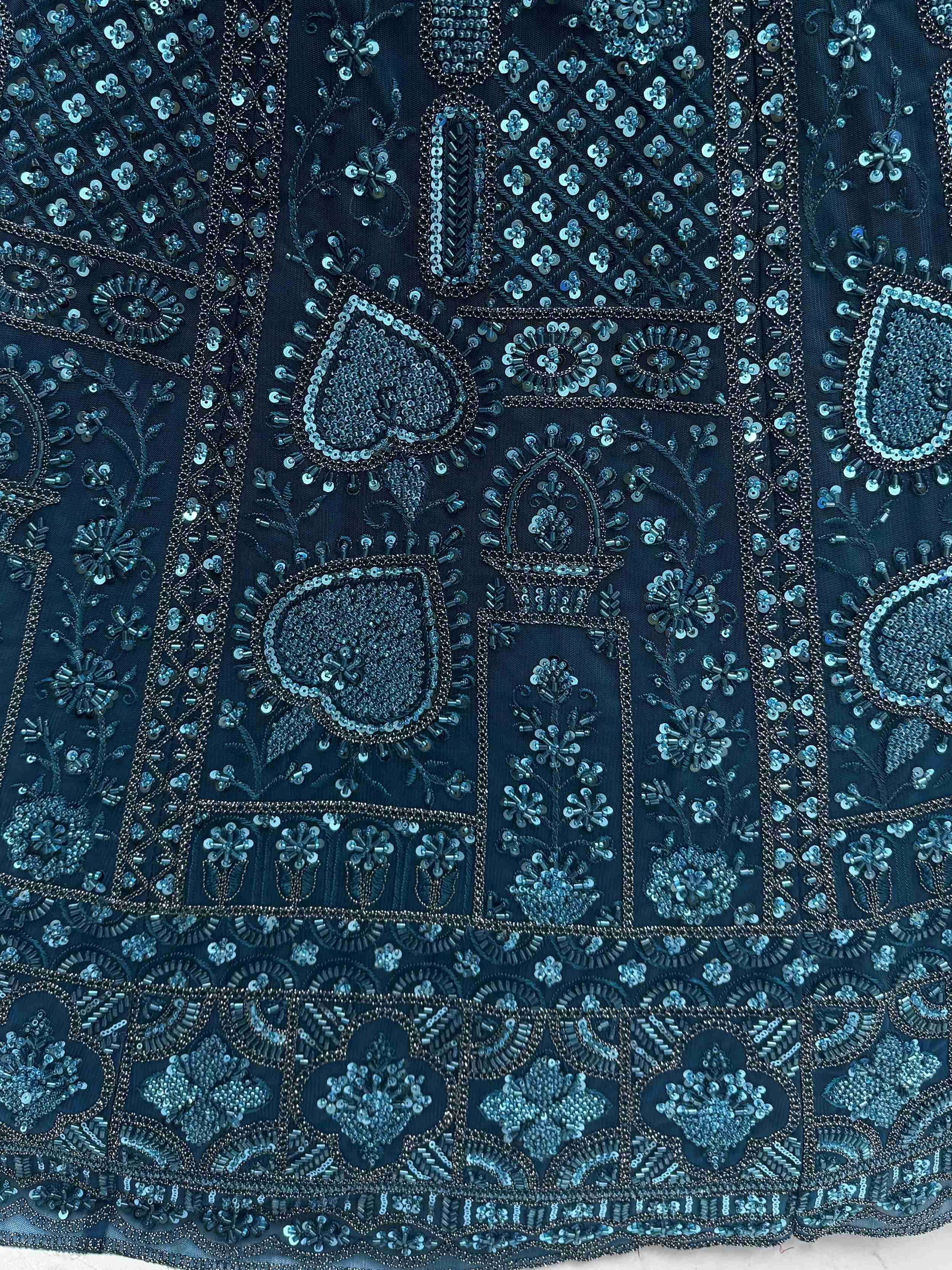 Dark blue ethnic wear with intricate sequin and bead embroidery, perfect for designer lehenga or saree.