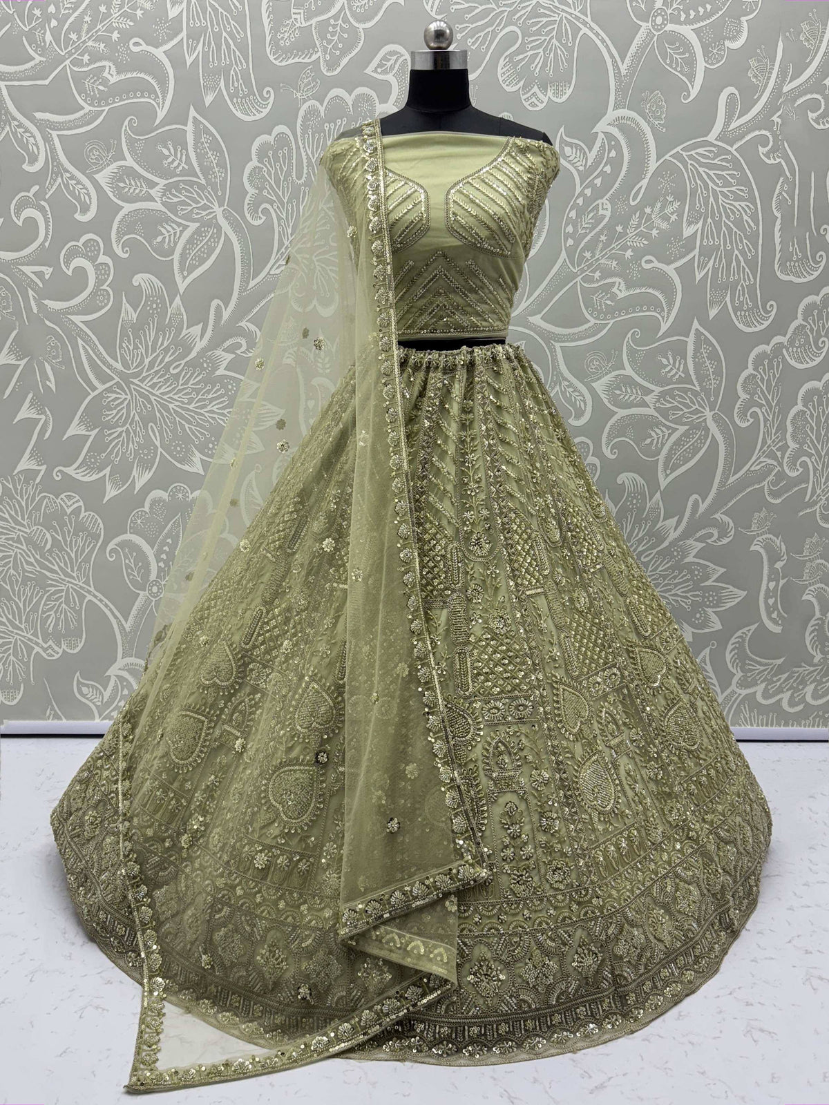 Olive green designer lehenga choli with heavy gold embroidery and sheer dupatta, ethnic Indian wear
