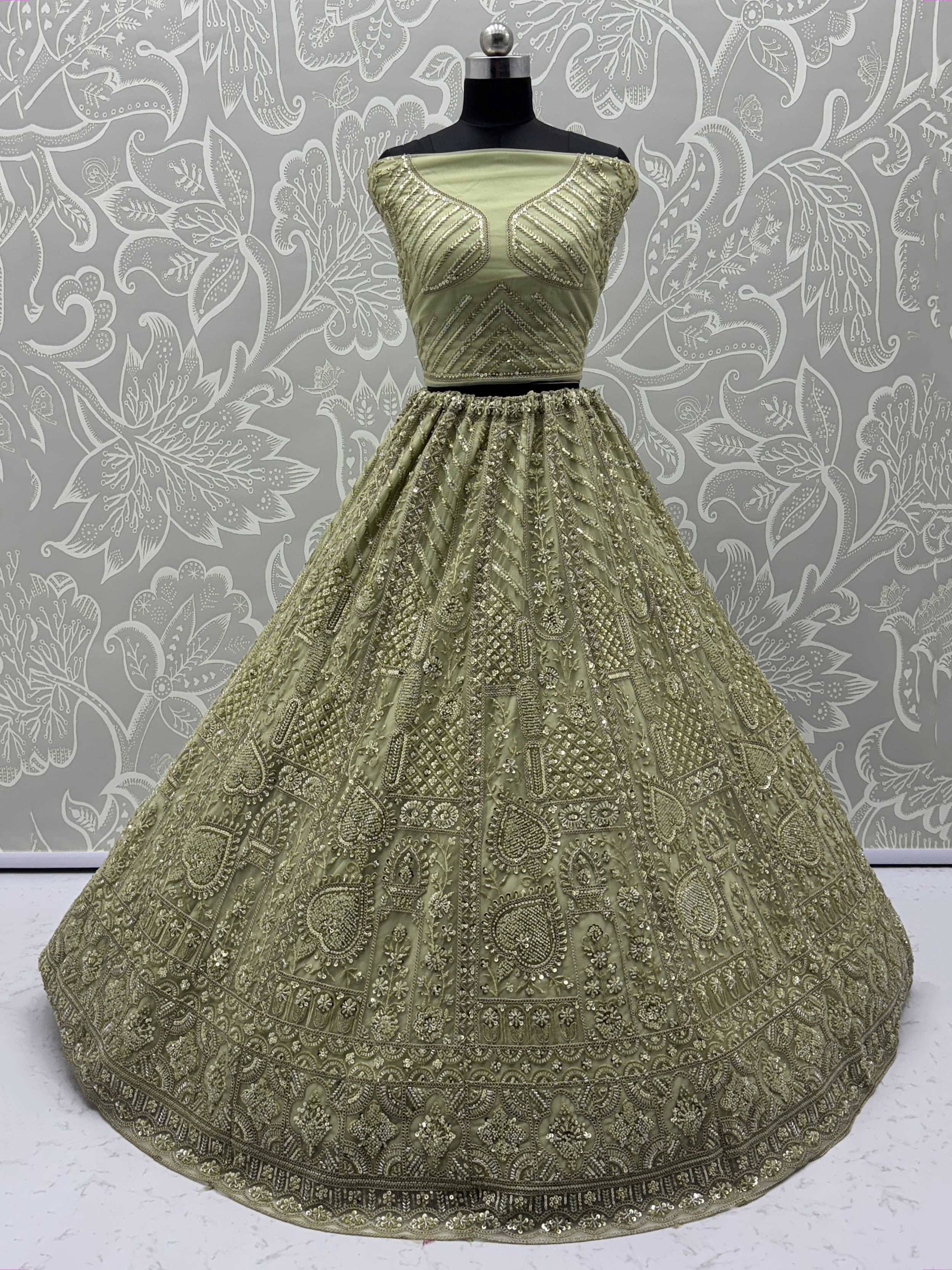 Olive green designer lehenga choli with intricate gold embroidery and sequin work, perfect for weddings and festivals.