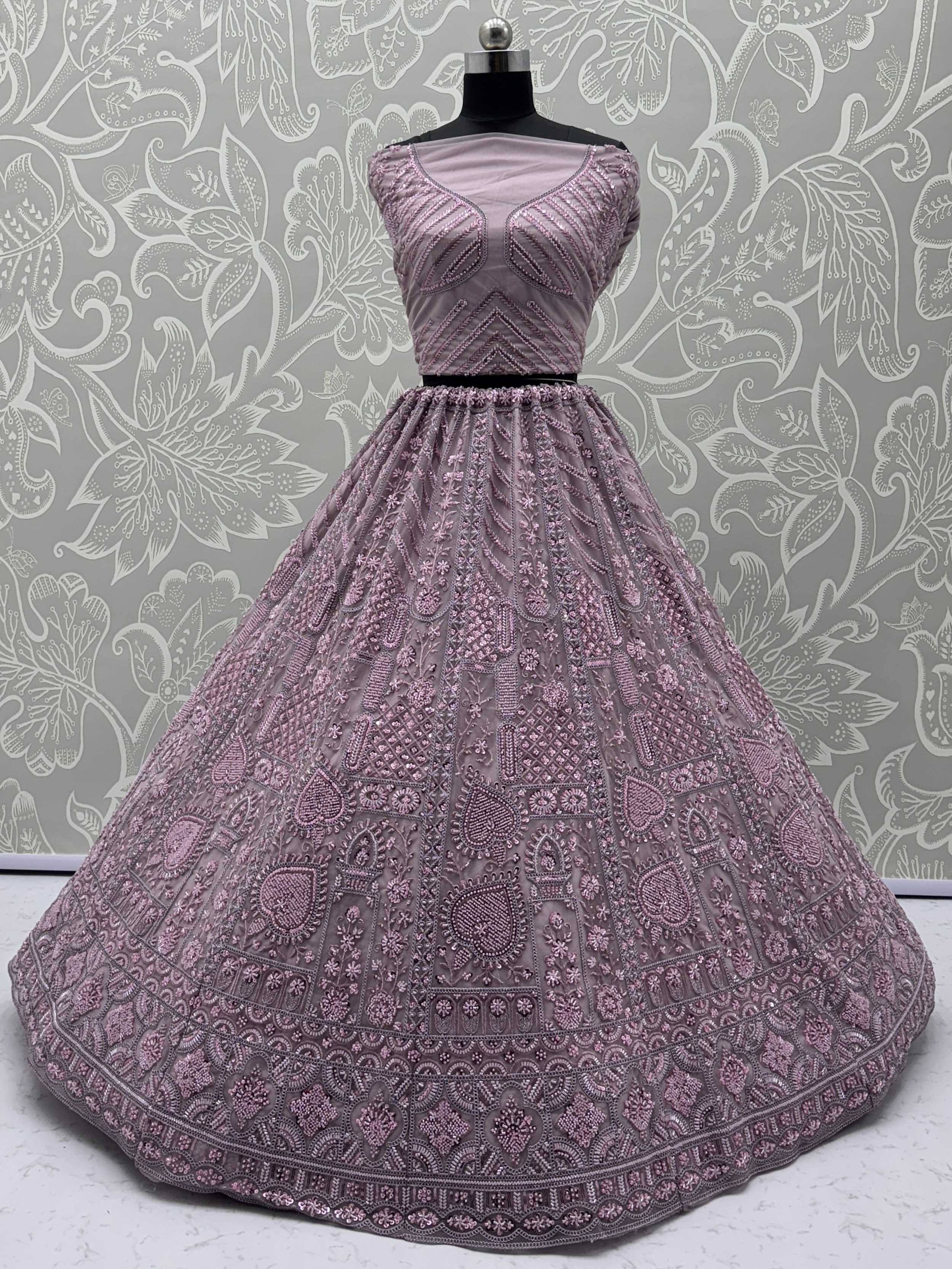 Dusty pink embroidered lehenga choli with detailed beadwork, perfect for Indian ethnic wear occasions.