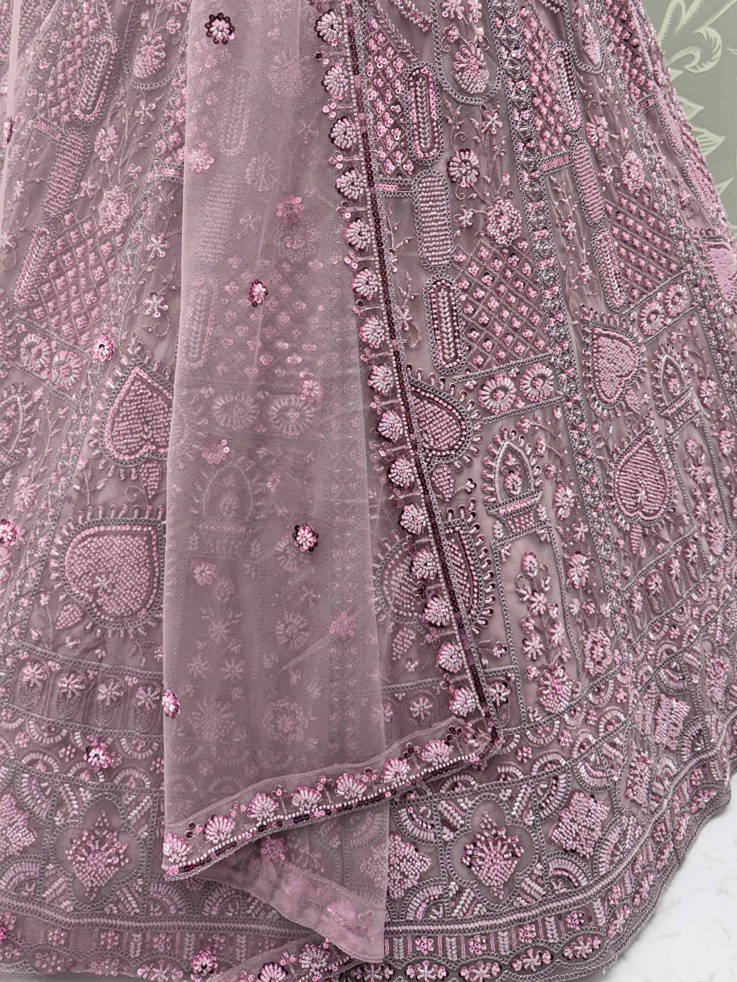 Dusty pink designer lehenga with intricate floral beadwork and sequin embroidery, perfect for Indian ethnic wear.