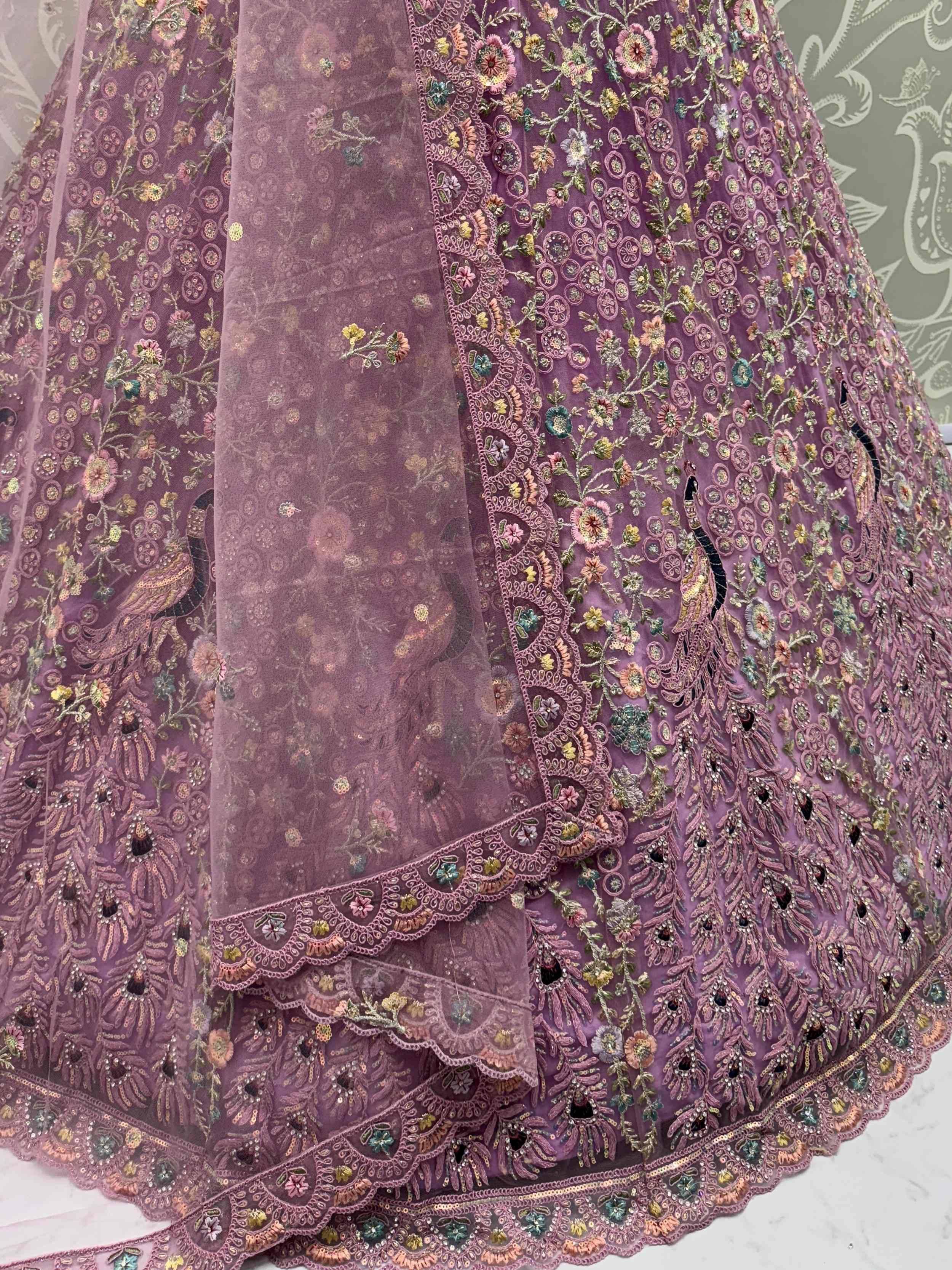 Purple embroidered lehenga with floral and peacock motifs, detailed lace and sequin work