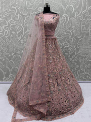 Magnetic Peach Net Sequins Wedding Wear Lehenga Choli With Dupatta
