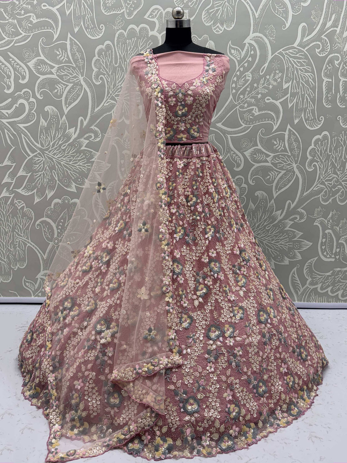 Pink floral embroidered lehenga choli with sheer dupatta, perfect for Indian ethnic wear