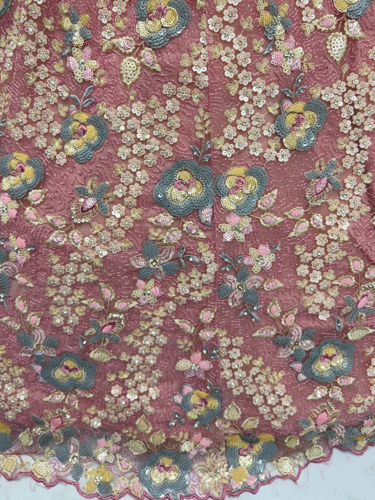 Elegant floral embroidery with sequins on pink ethnic fabric for lehenga or saree