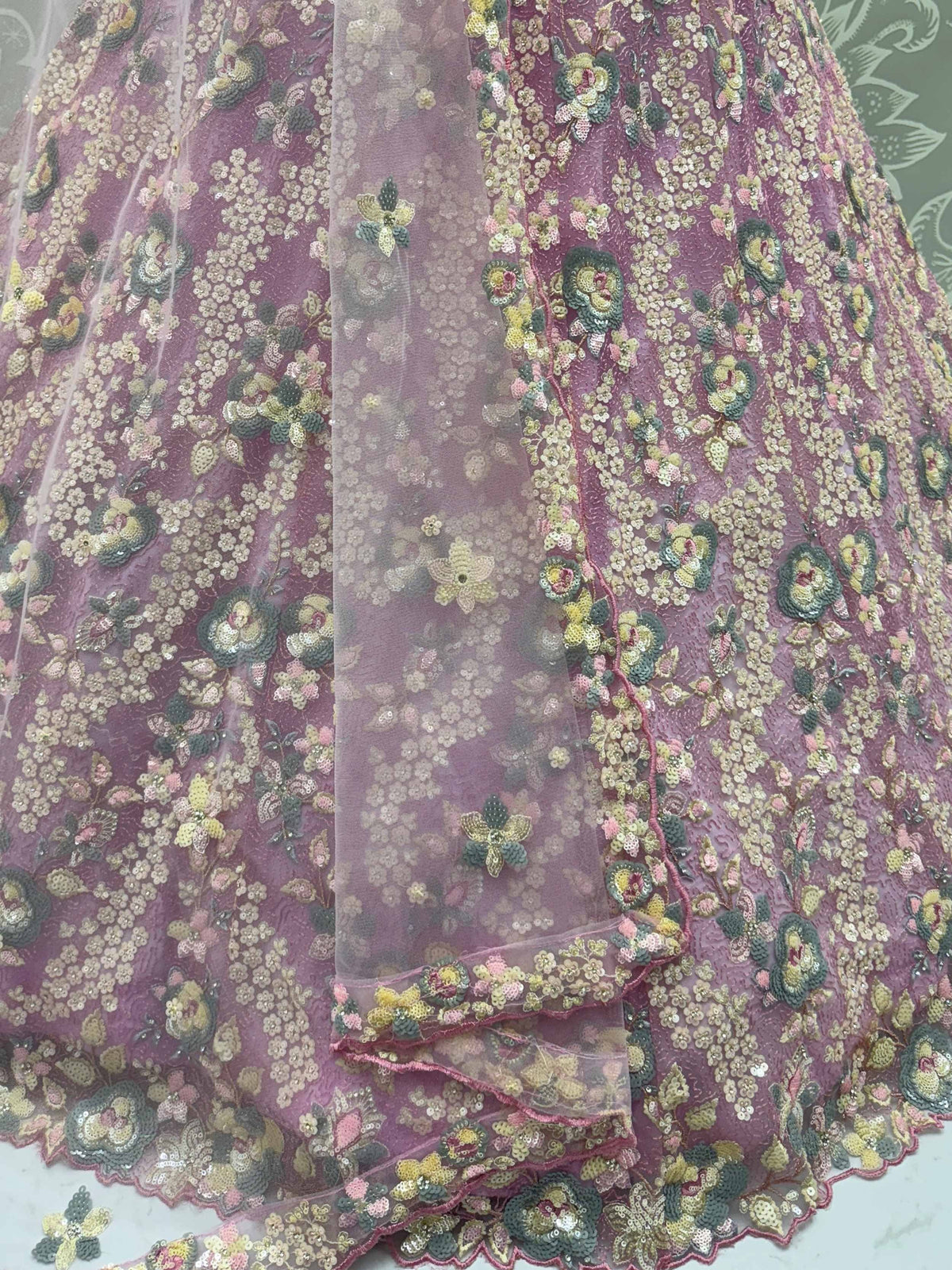 Elegant purple lehenga with floral sequin embroidery and sheer overlay