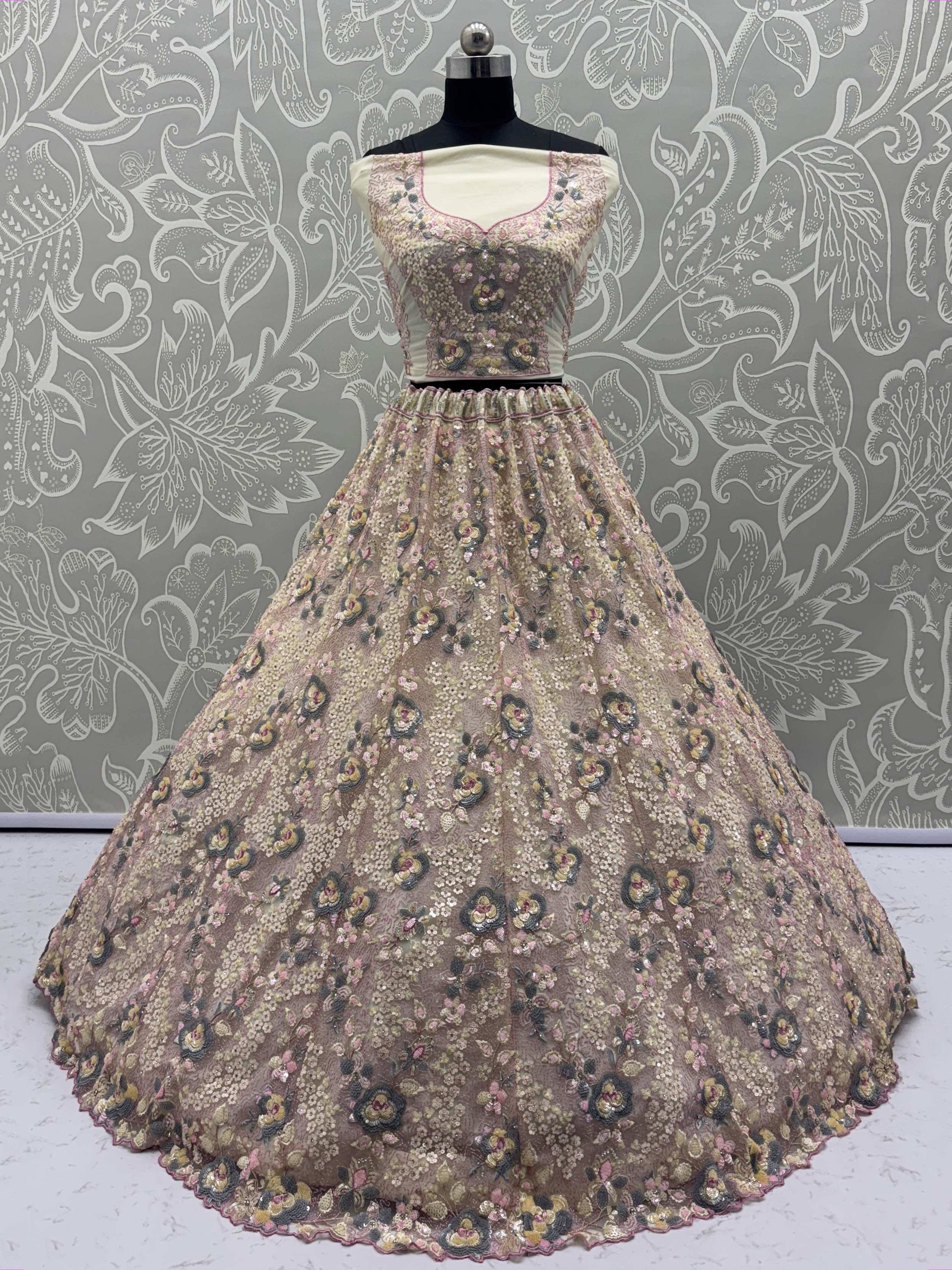 Elegant floral embroidered lehenga choli with intricate detailing and pastel hues