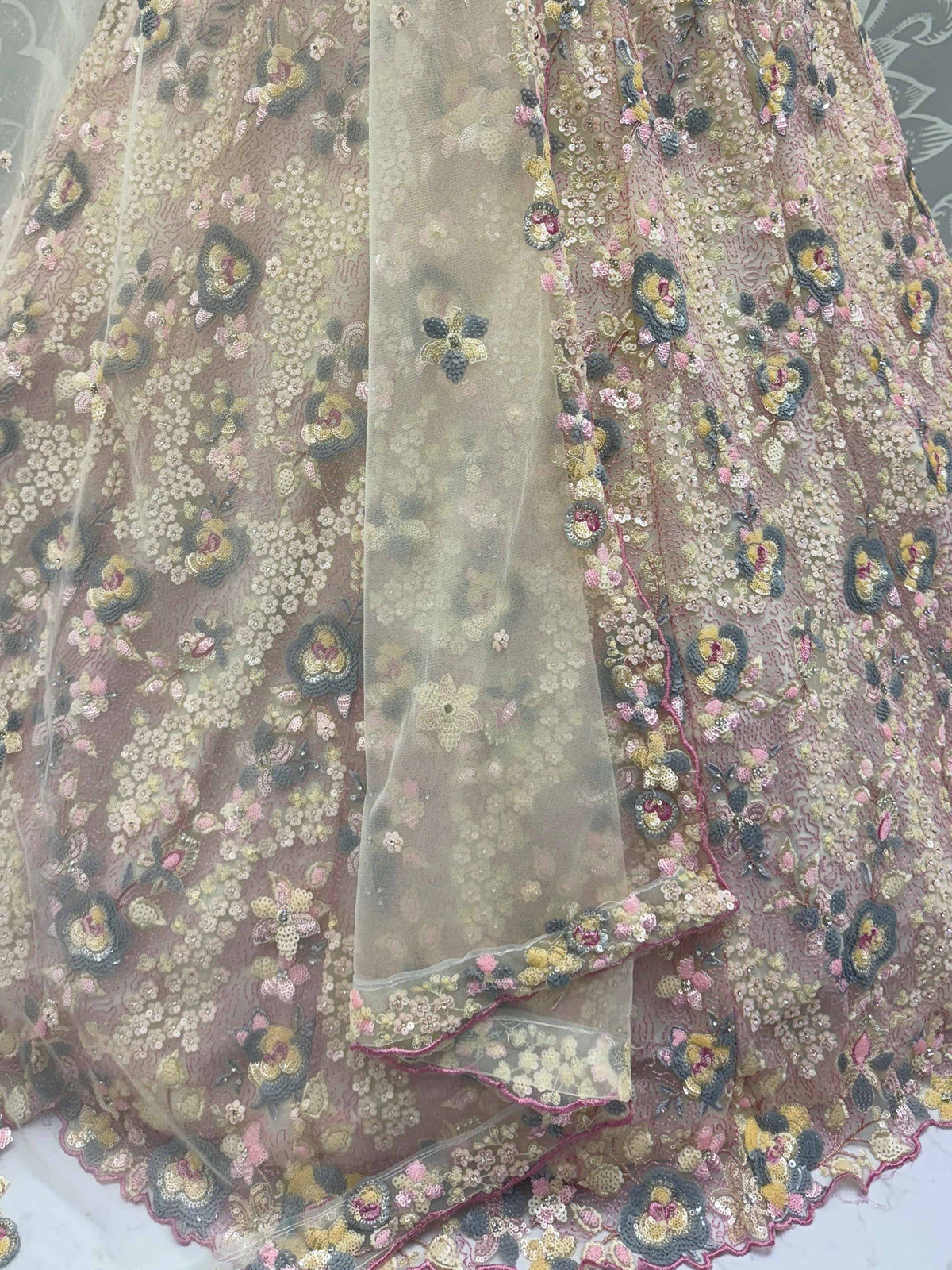 Elegant floral embroidered lehenga with sequins and sheer overlay, perfect for Indian ethnic wear.