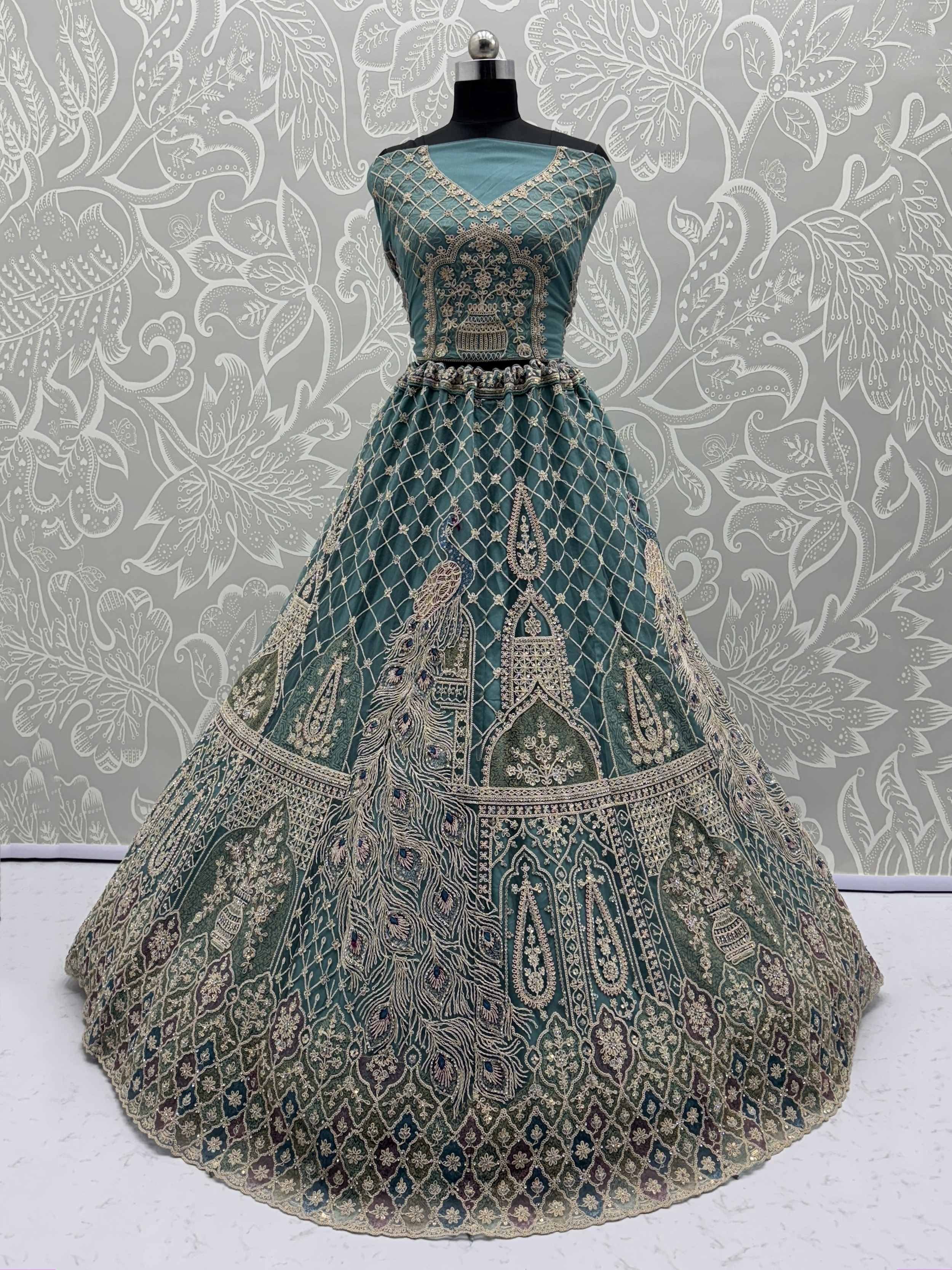Teal designer lehenga with peacock embroidery and gold detailing, perfect for Indian ethnic wear