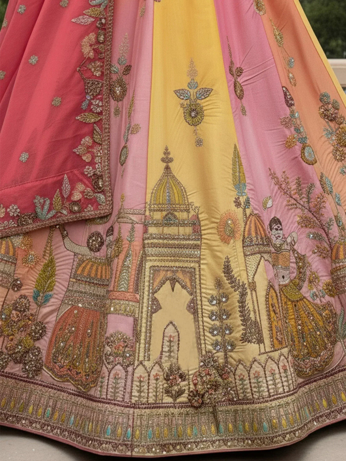 Embroidered Indian lehenga with palace and floral motifs in pink and yellow