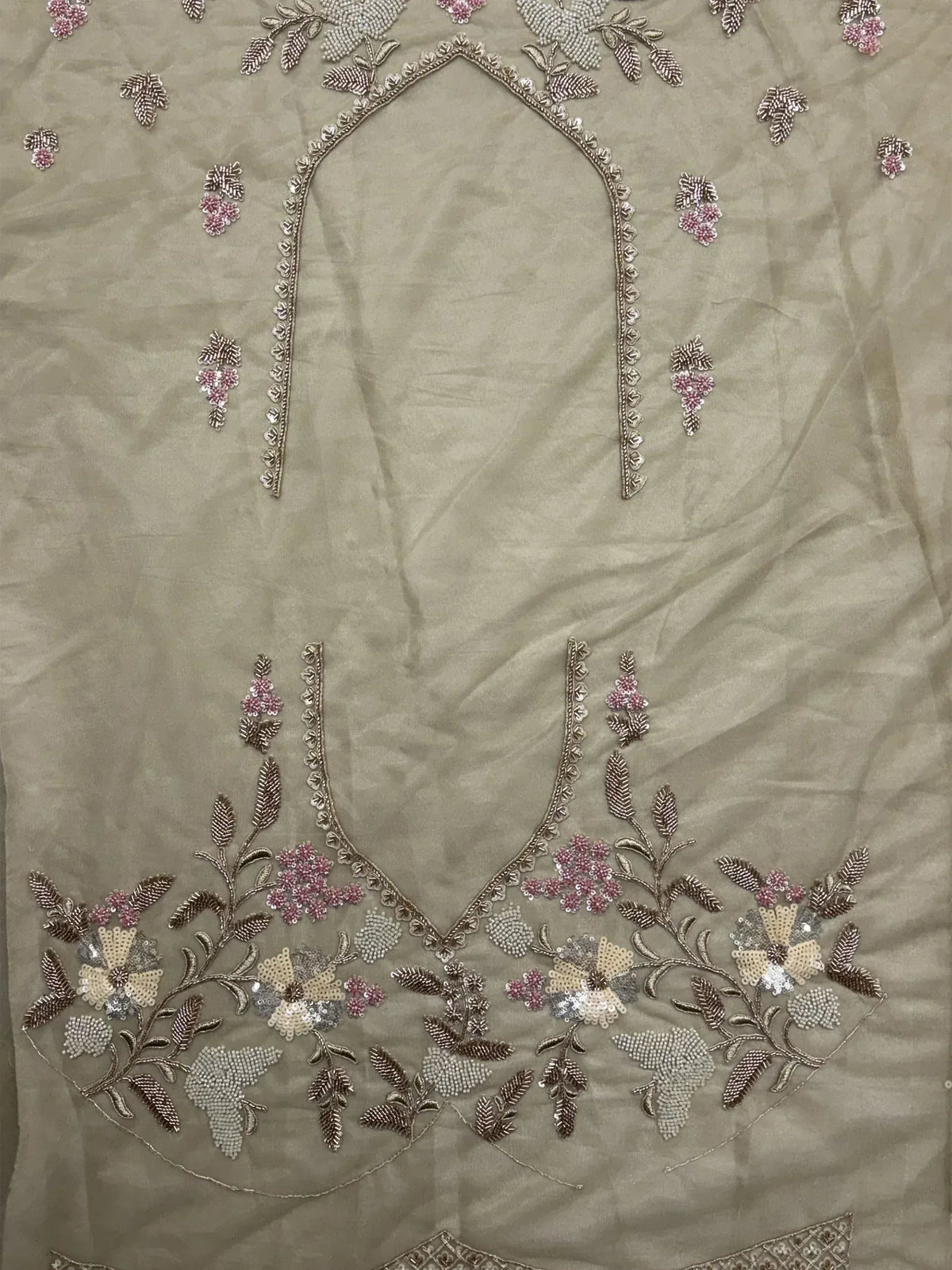 Beige ethnic wear with floral embroidery and sequin detailing, perfect for Indian designer lehenga or salwar kameez.