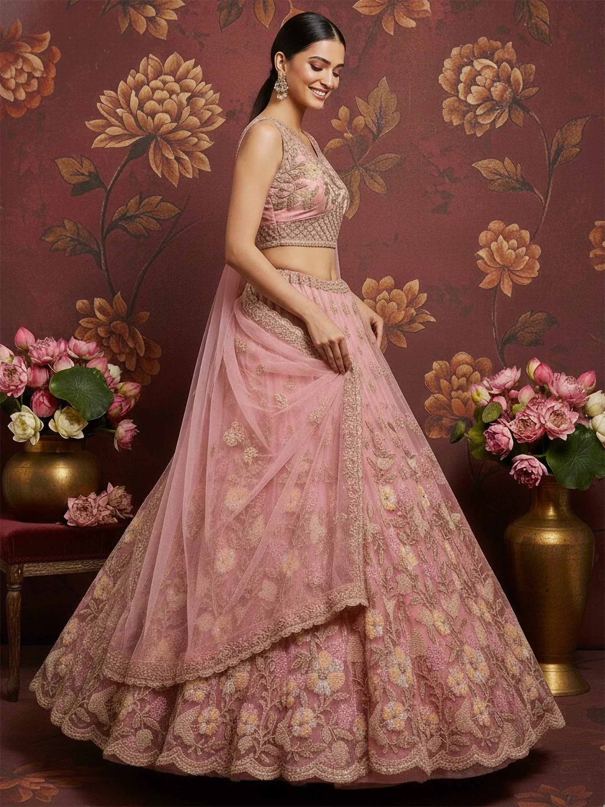 Pink embroidered lehenga choli with floral detailing, perfect for Indian weddings and festive occasions