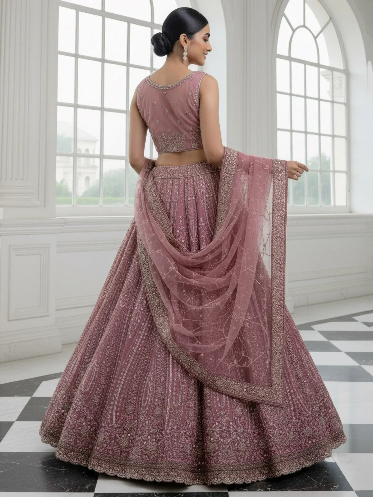 Elegant mauve lehenga choli with intricate embroidery and sheer dupatta, perfect for Indian ethnic occasions.