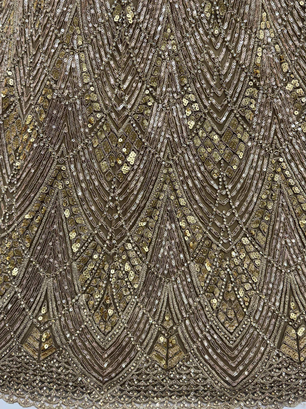 Elegant gold and silver sequin embroidery on ethnic wear fabric, perfect for designer lehengas or sarees.