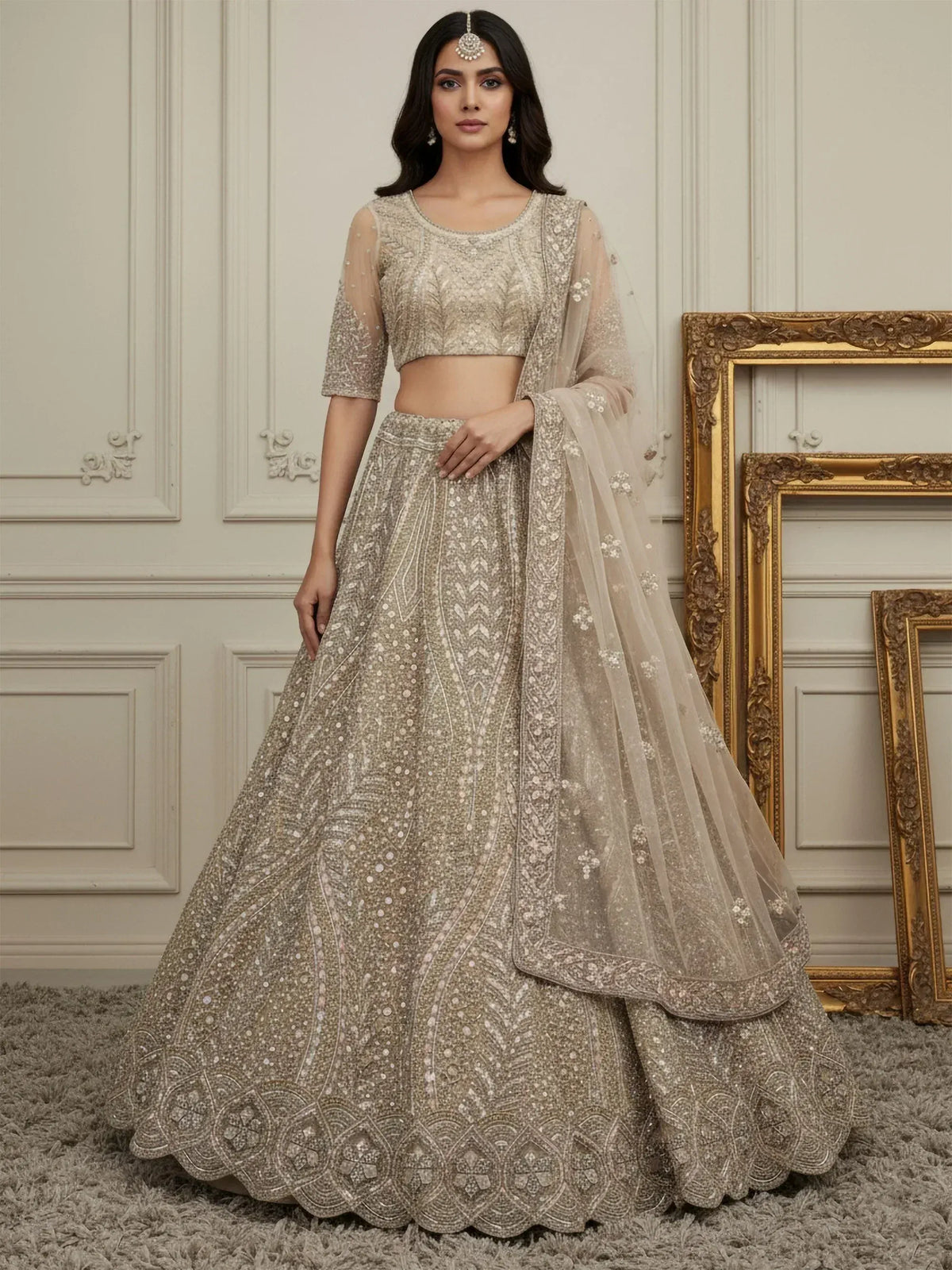 Elegant beige embroidered lehenga choli with sheer dupatta, perfect for weddings and festive occasions.