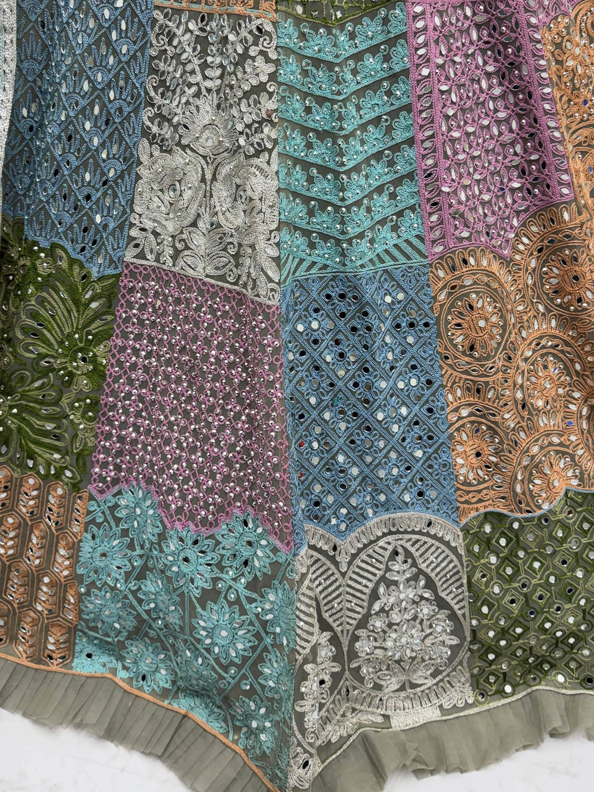 Colorful embroidered ethnic wear with mirror work, perfect for lehenga choli or saree designs.