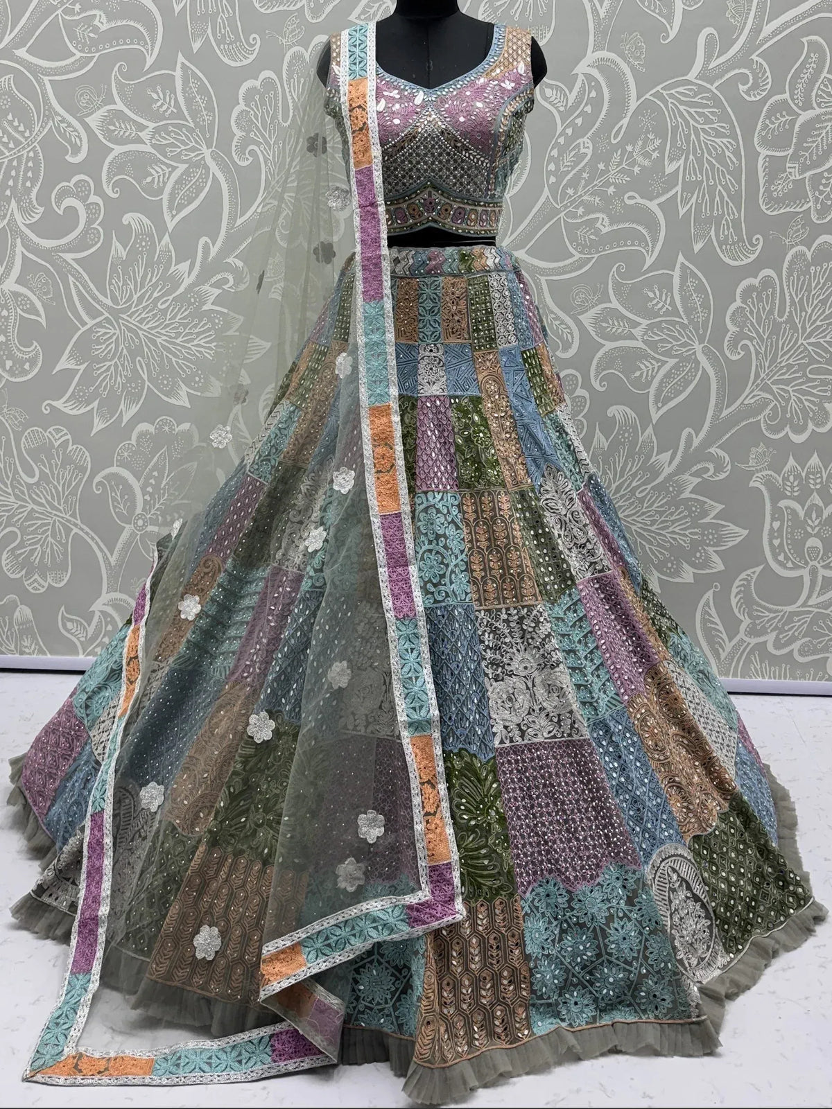 Designer patchwork lehenga choli with intricate embroidery and vibrant colors for ethnic wear