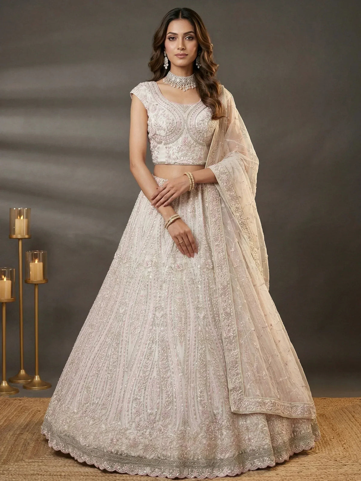 Elegant ivory lehenga choli with intricate embroidery, perfect for Indian weddings and festive occasions.