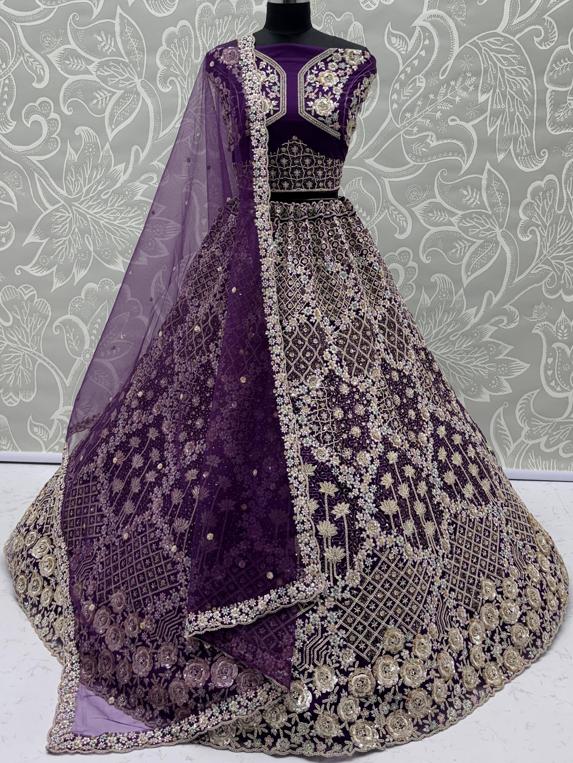 Purple designer lehenga choli with intricate gold embroidery and floral patterns