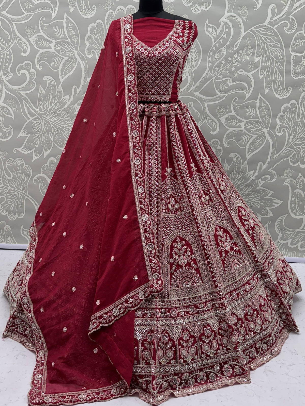 Maroon designer lehenga choli with intricate embroidery and embellishments for ethnic wear
