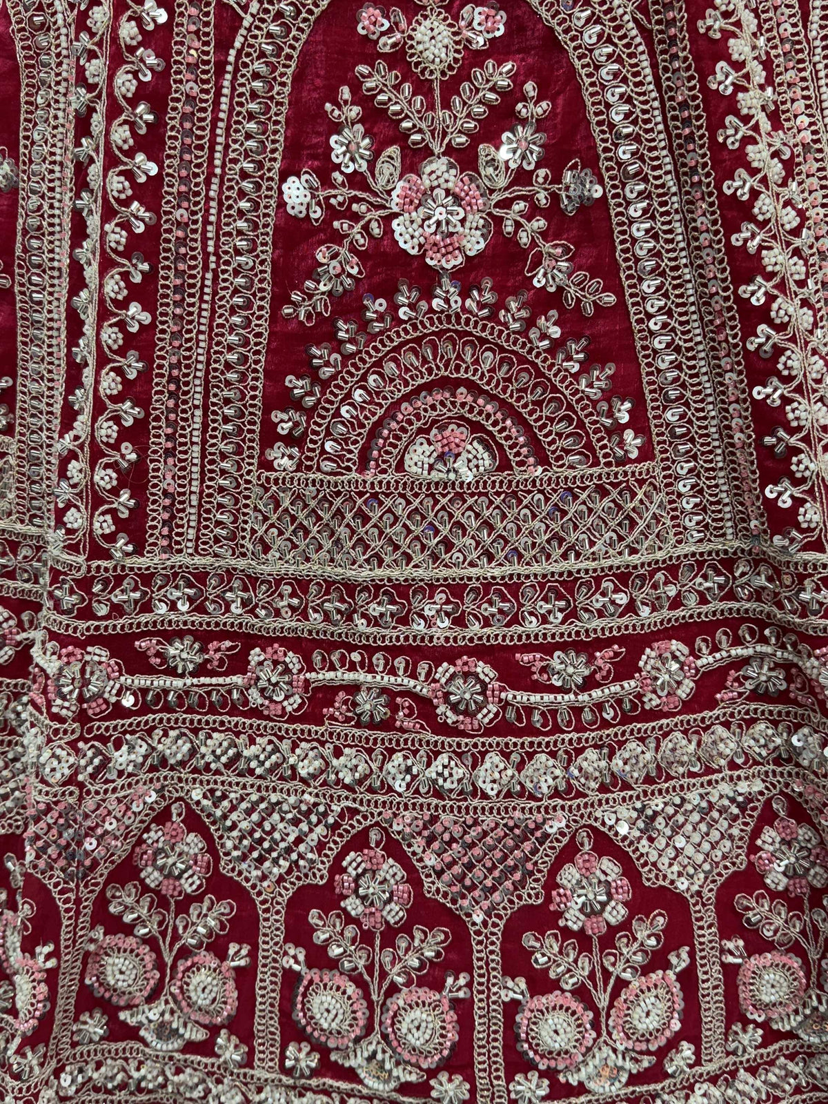 Richly embroidered maroon ethnic wear with floral beadwork and mirror detailing