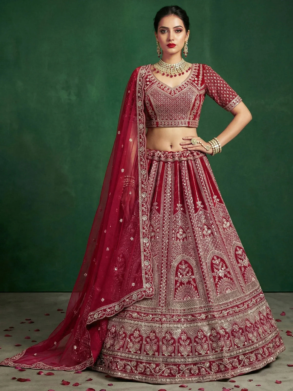 Elegant maroon lehenga choli with intricate gold embroidery and matching dupatta for Indian ethnic wear
