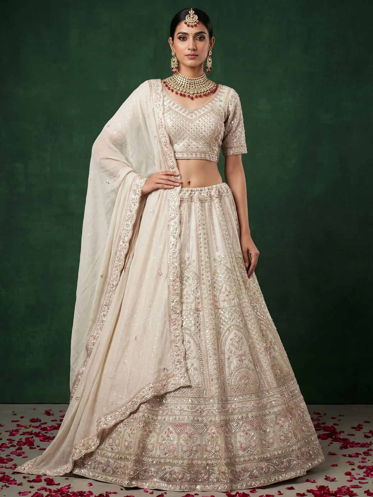 Elegant cream lehenga choli with intricate embroidery and floral details, perfect for Indian weddings.