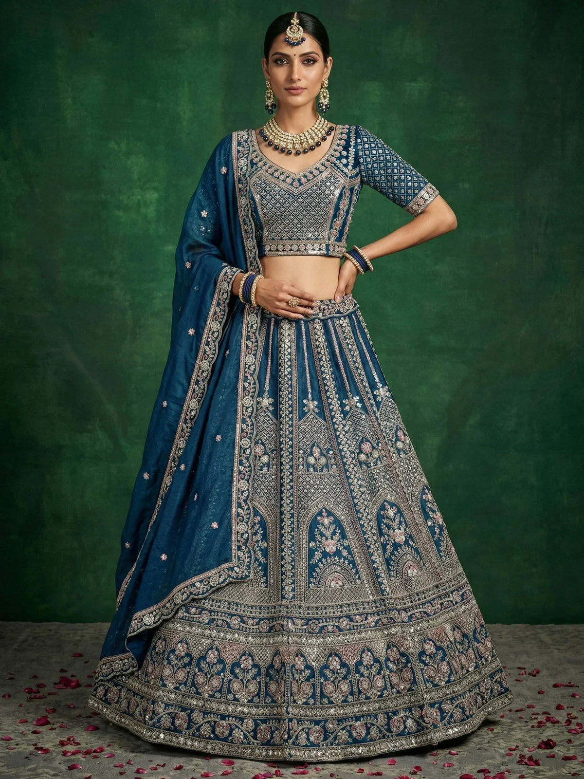 Elegant blue lehenga choli with intricate silver embroidery and floral motifs, perfect for Indian weddings and festive occasions.