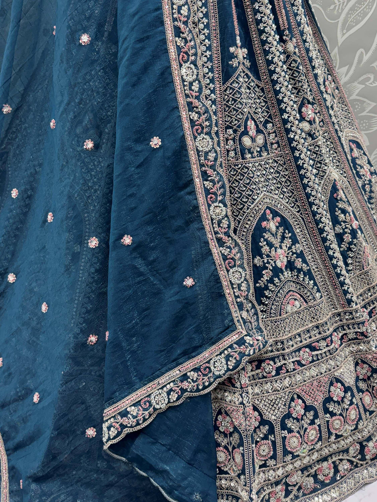 Elegant blue ethnic lehenga with intricate floral embroidery and embellishments