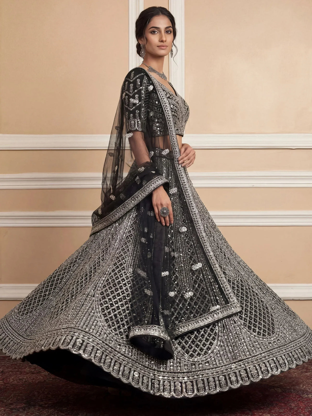 Elegant black lehenga choli with silver embroidery and sheer dupatta for Indian ethnic wear