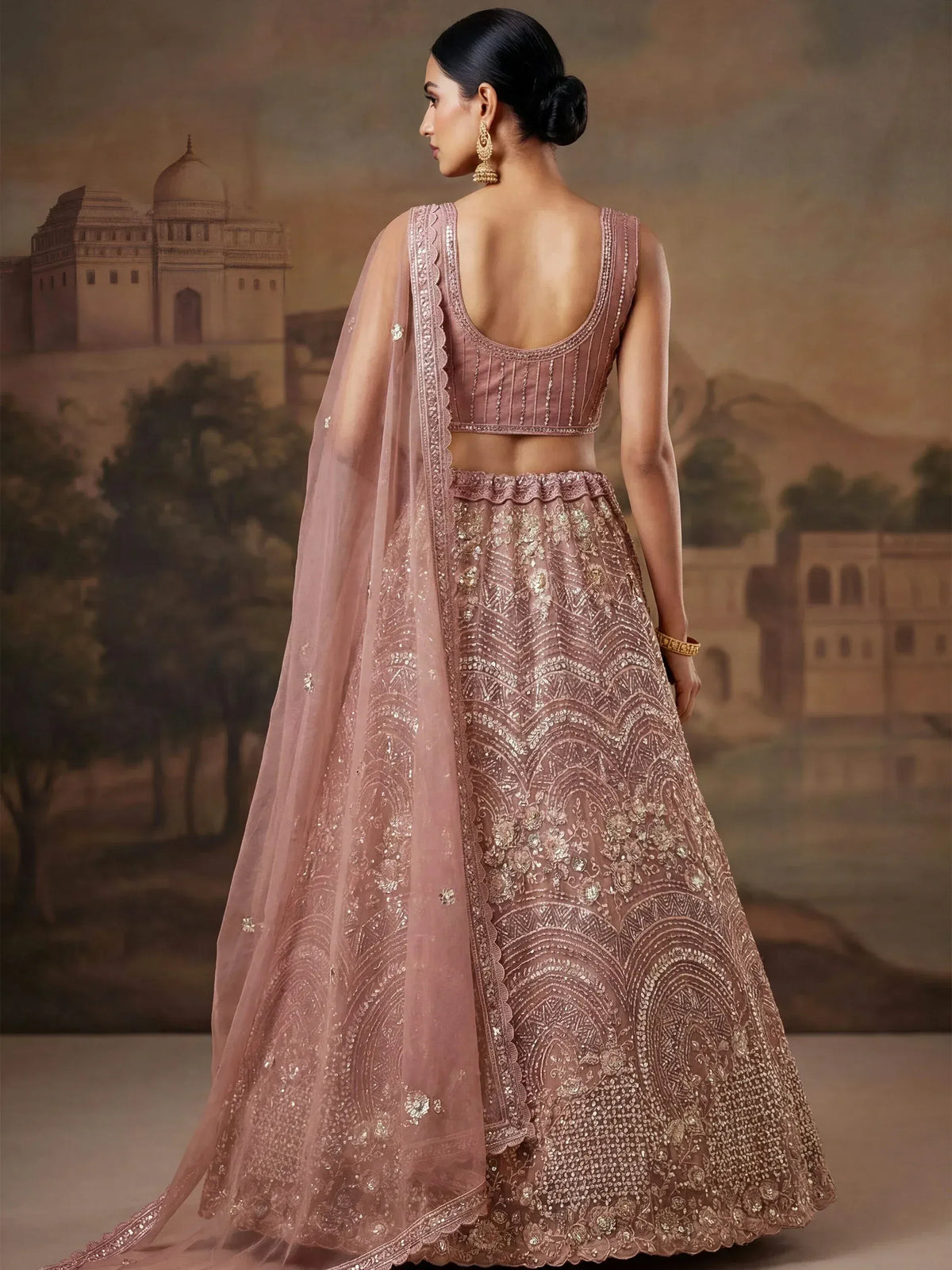 Dusty pink embroidered lehenga choli with scalloped dupatta, perfect for Indian weddings and festive occasions.