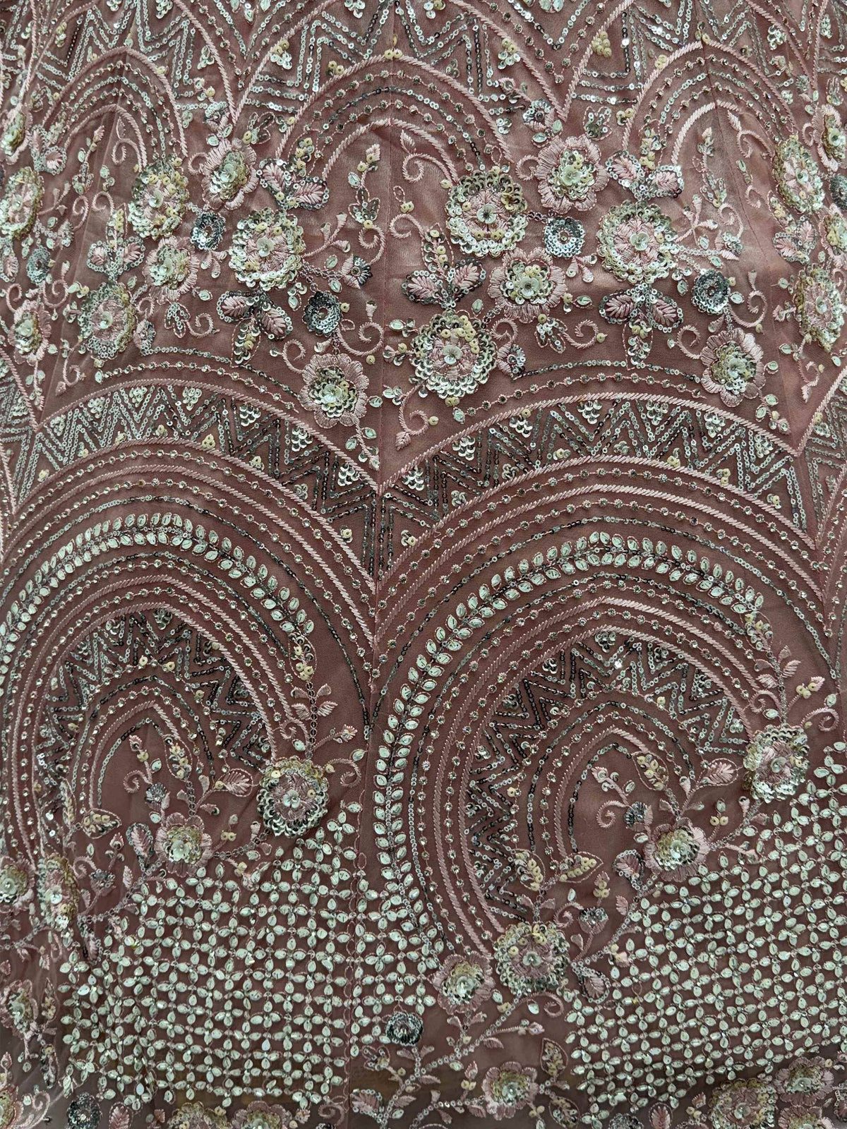 Dusty rose ethnic gown with intricate floral sequin and bead embroidery, perfect for Indian weddings or festive occasions.