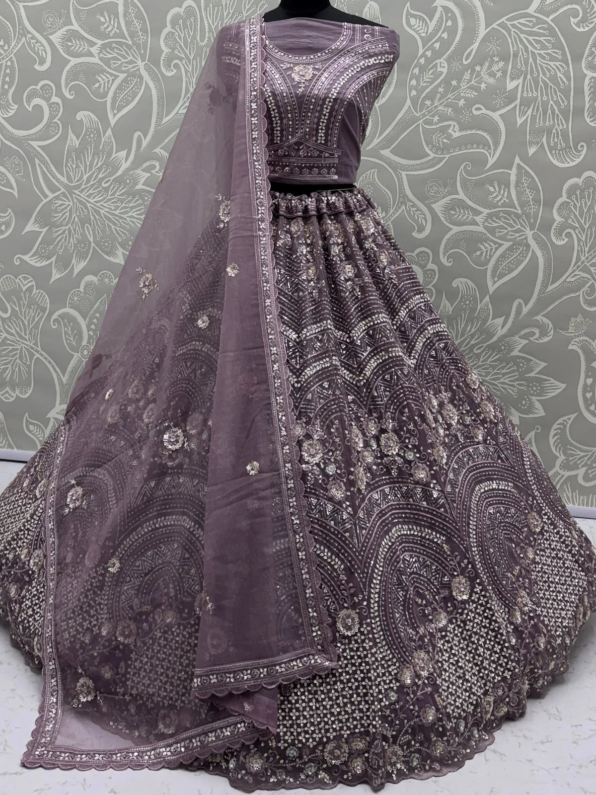 Charming Purple Embroidered Net Engagement Wear Lehenga Choli