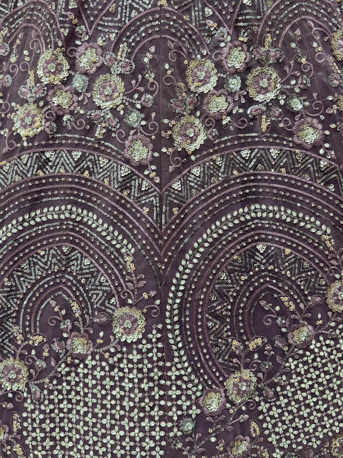 Elegant purple ethnic gown with intricate floral sequin embroidery and detailed threadwork.
