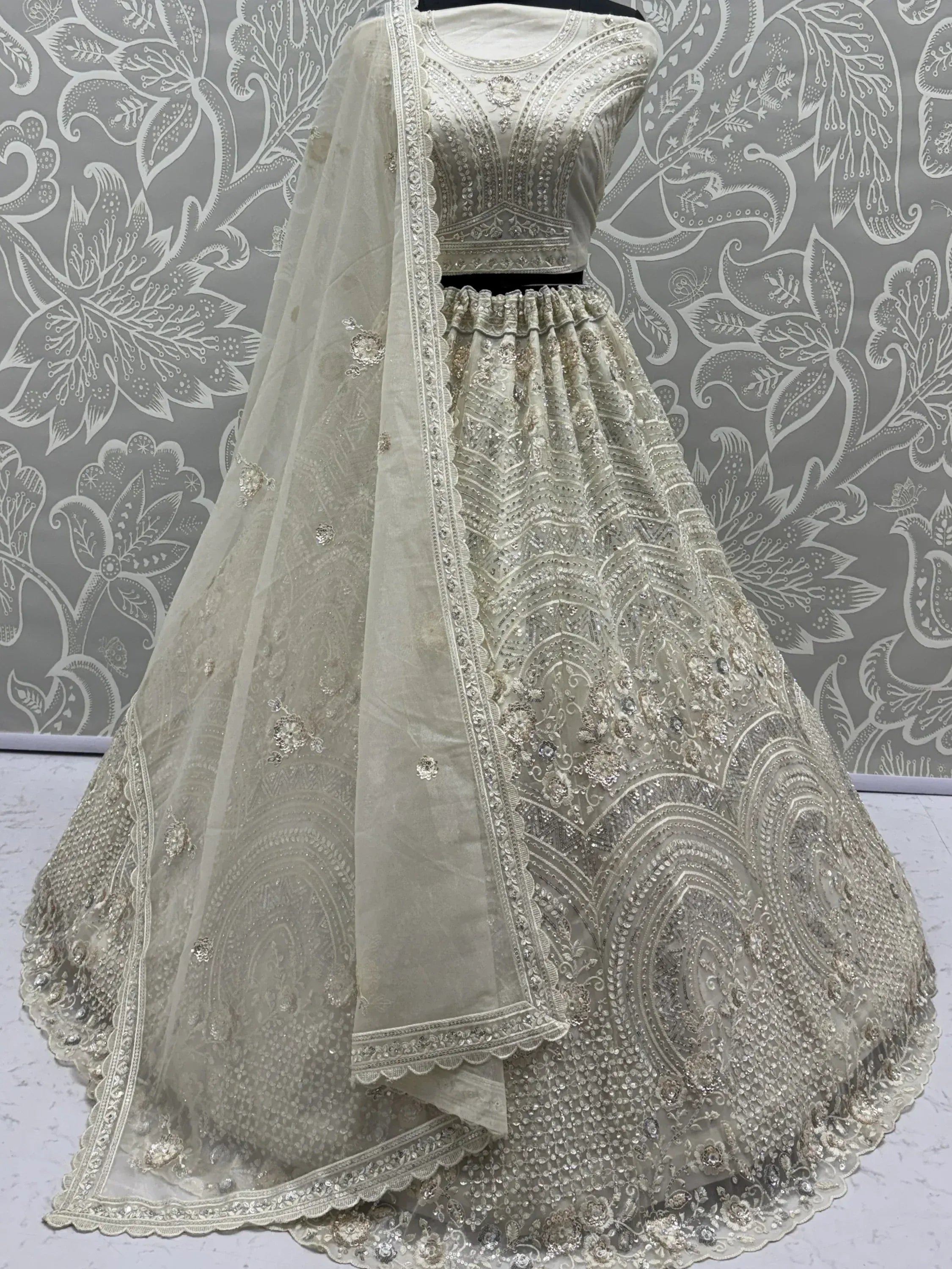 Stunning White Embroidered Net Sangeet Wear Lehenga Choli