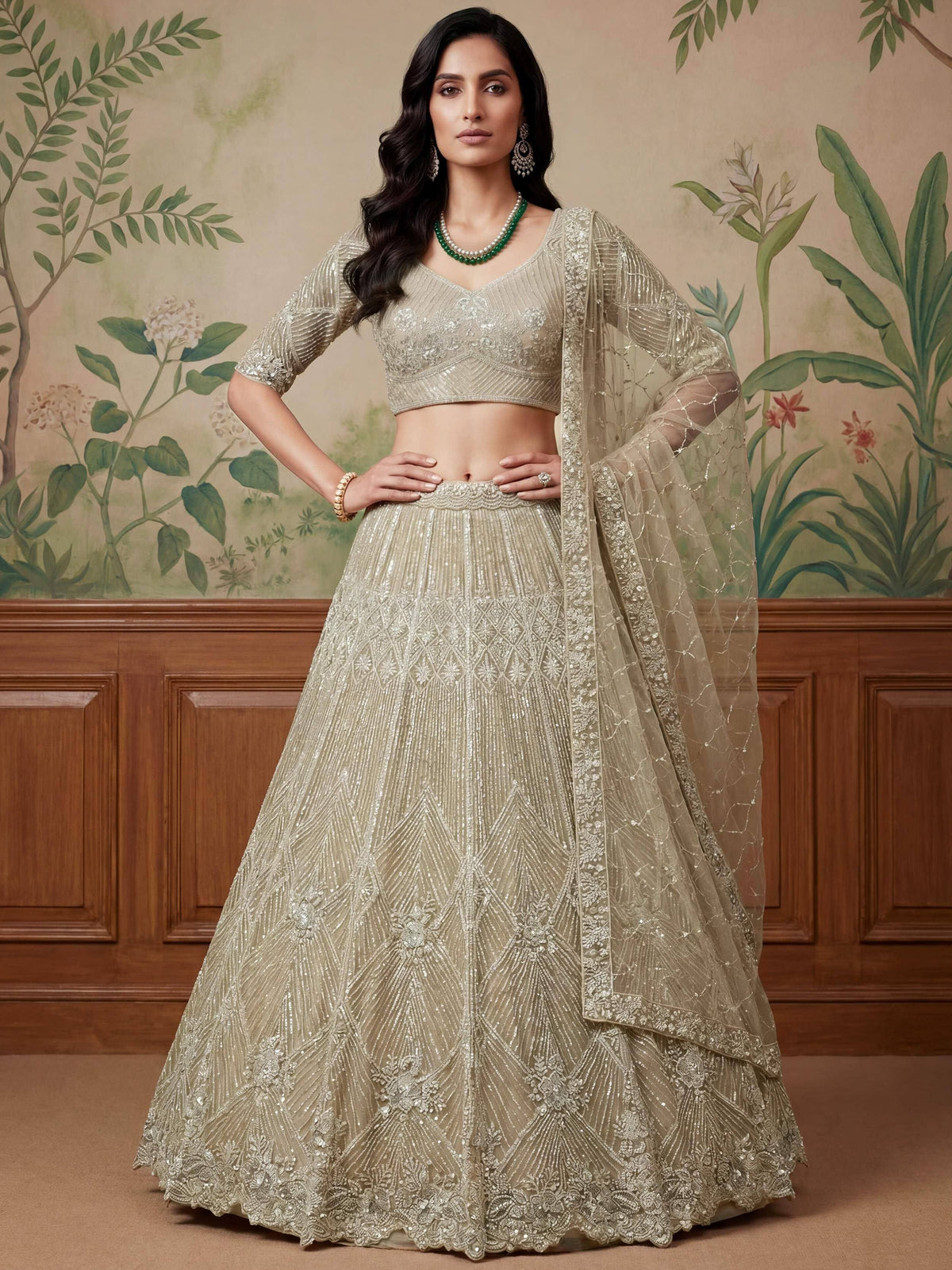 Elegant beige designer lehenga choli with intricate embroidery and sequin work, perfect for Indian weddings and festive occasions.