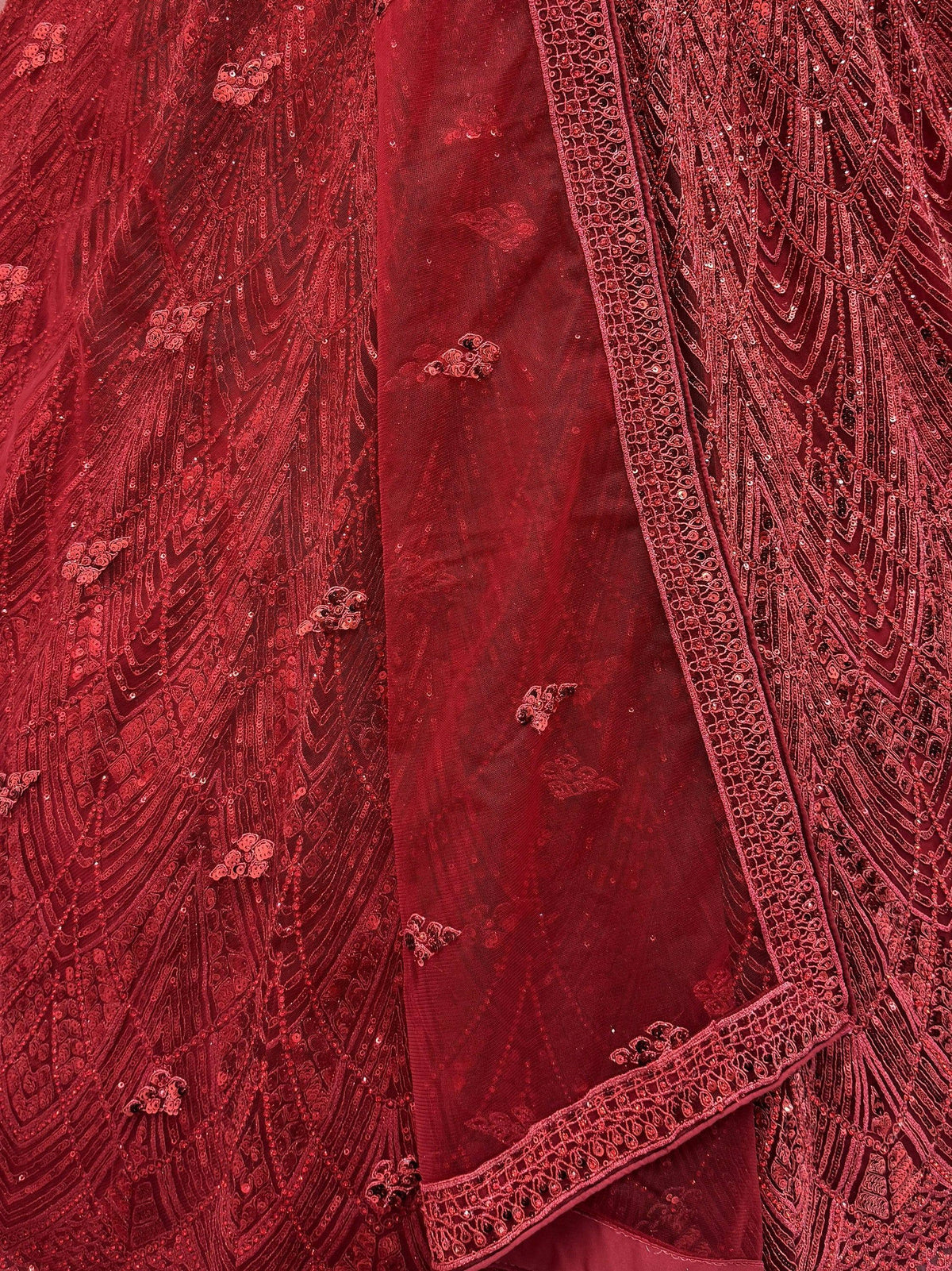 Rich red ethnic gown with intricate sequin and thread embroidery, perfect for Indian weddings and festive occasions.