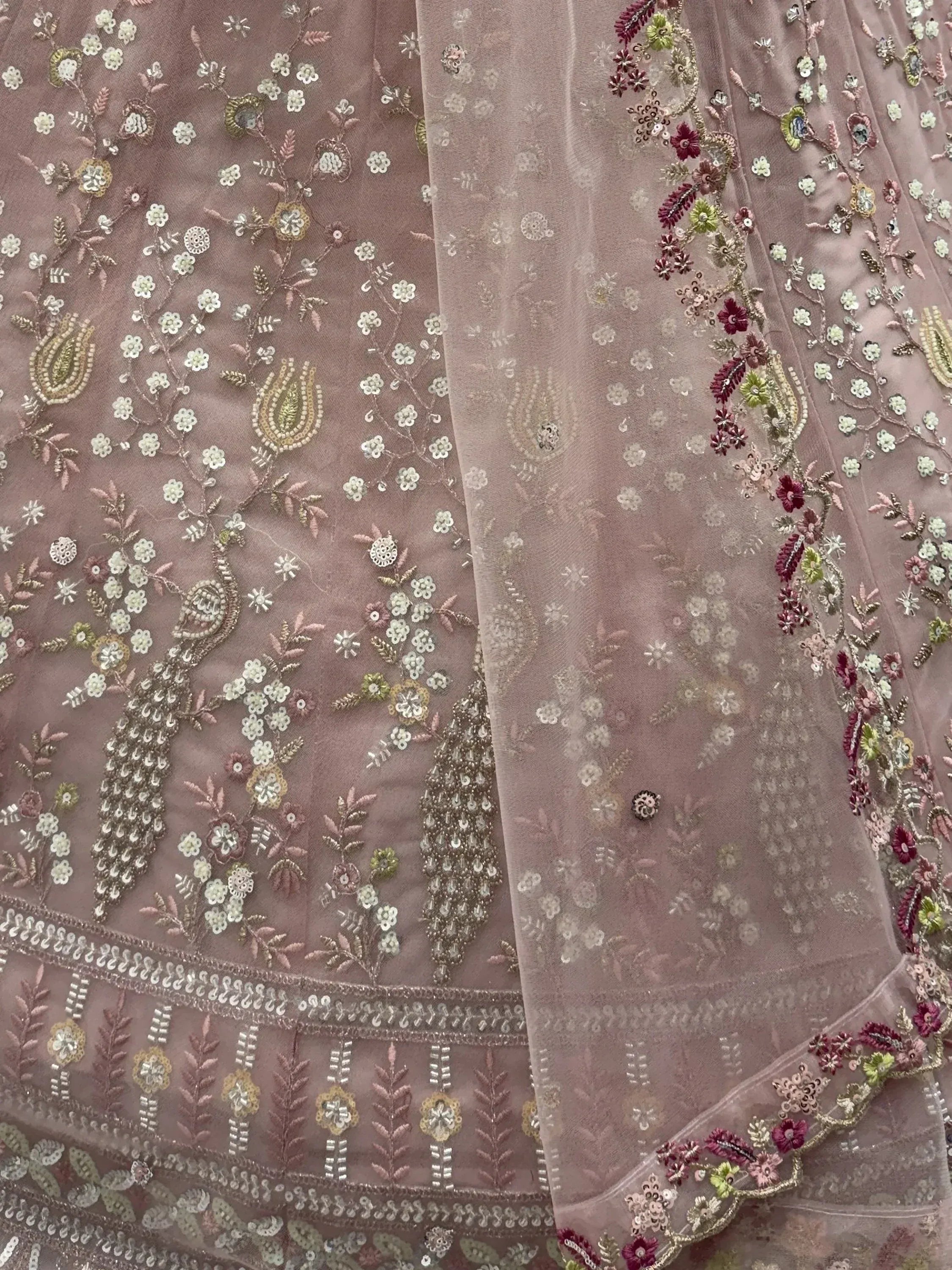Captivating Peach Embroidered Net Wedding Wear Lehenga Choli