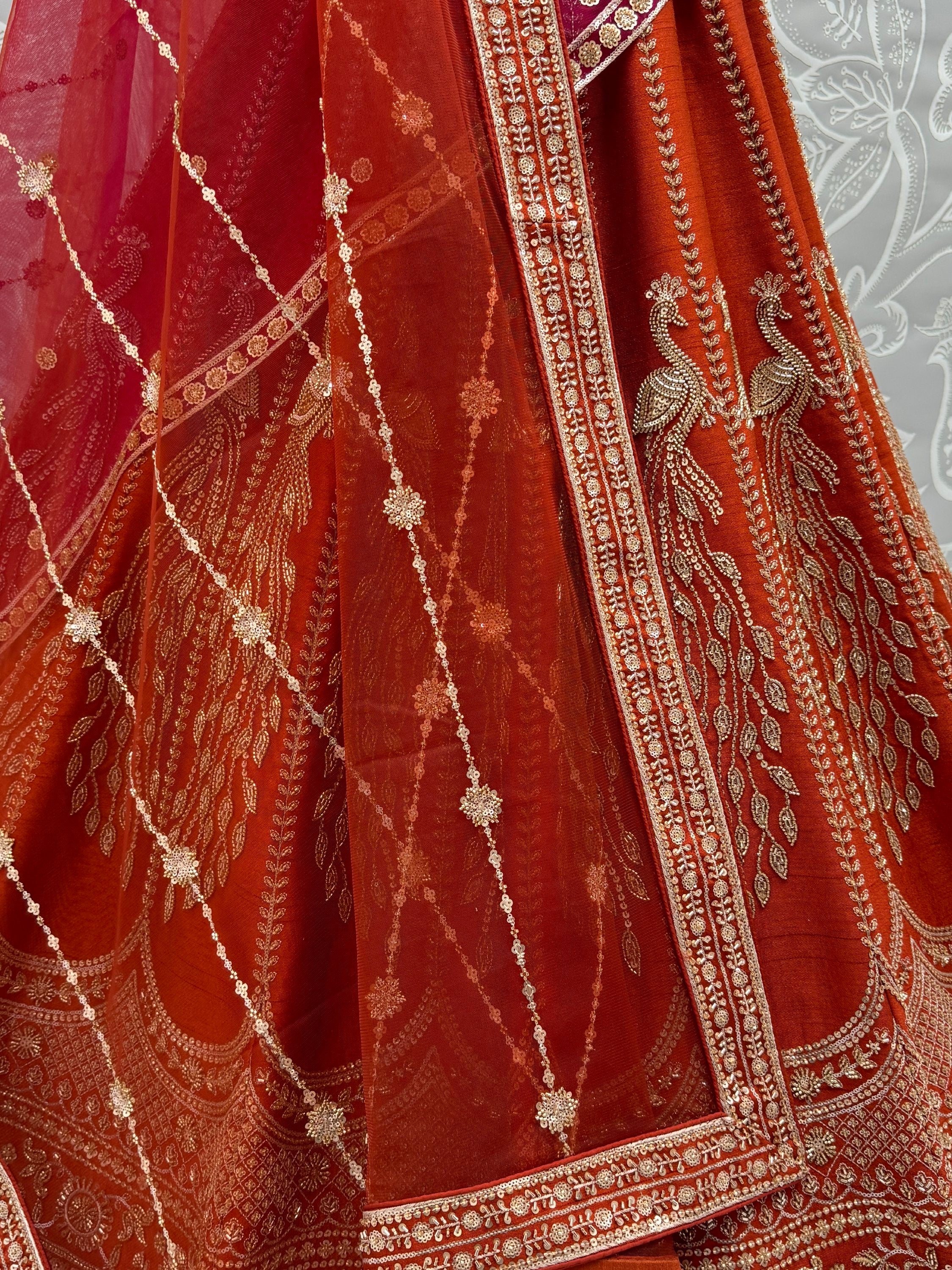 Stylish Rust Orange Hand Work Bridal Lehenga Choli With Double Dupatta
