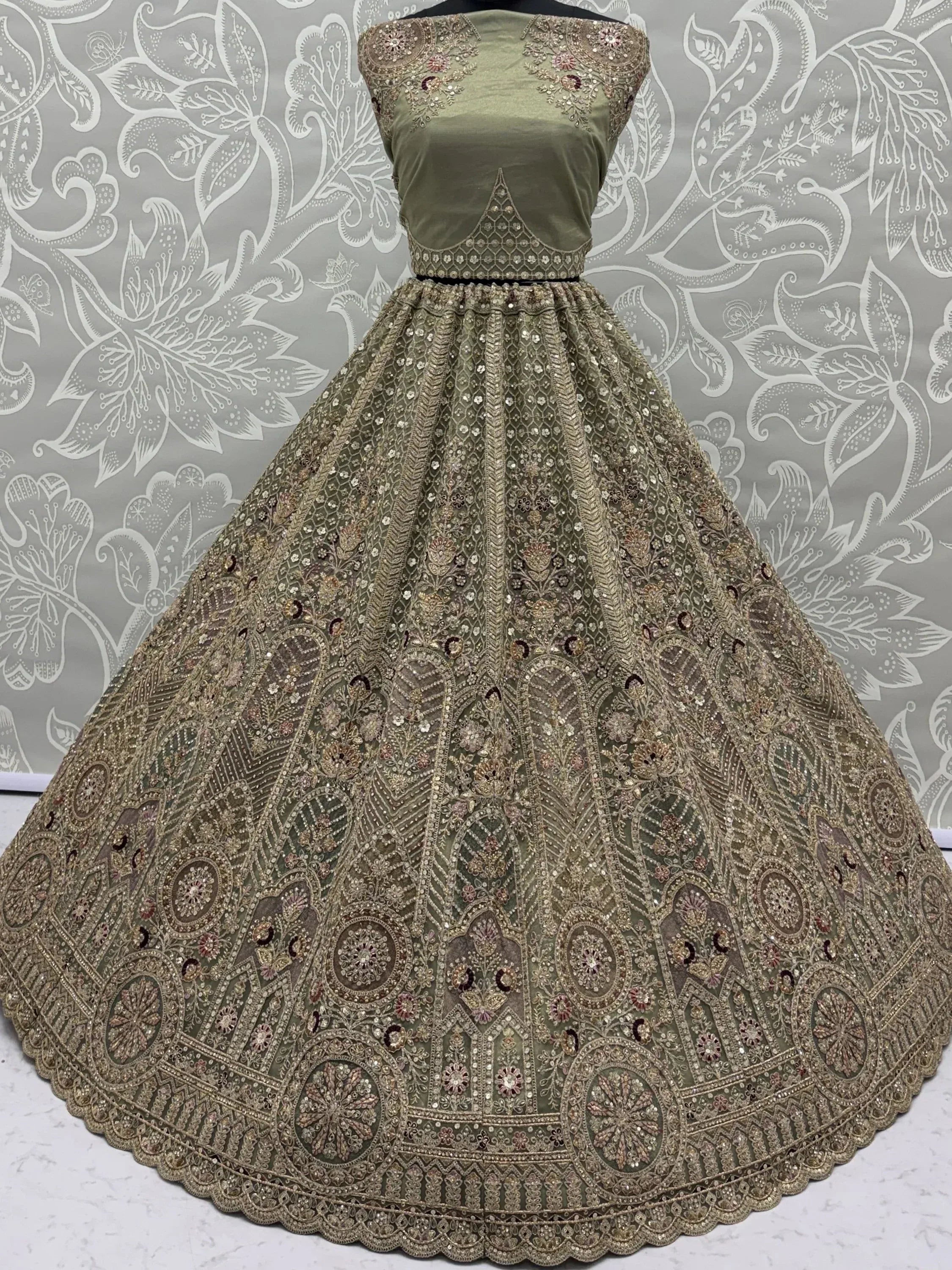 Ravishing Green Heavy Embroidered Net Evening Wear Lehenga Choli