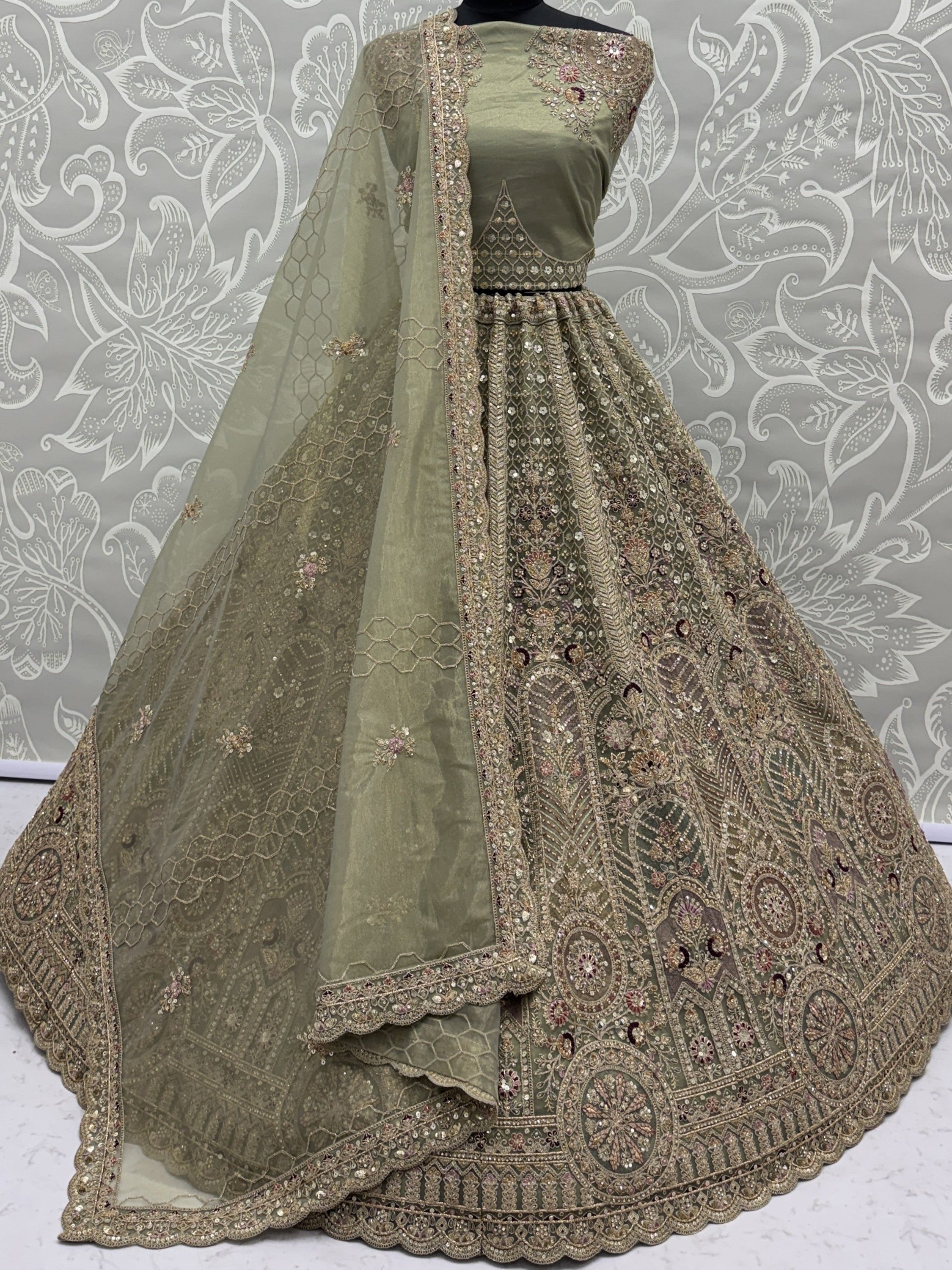Ravishing Green Heavy Embroidered Net Evening Wear Lehenga Choli