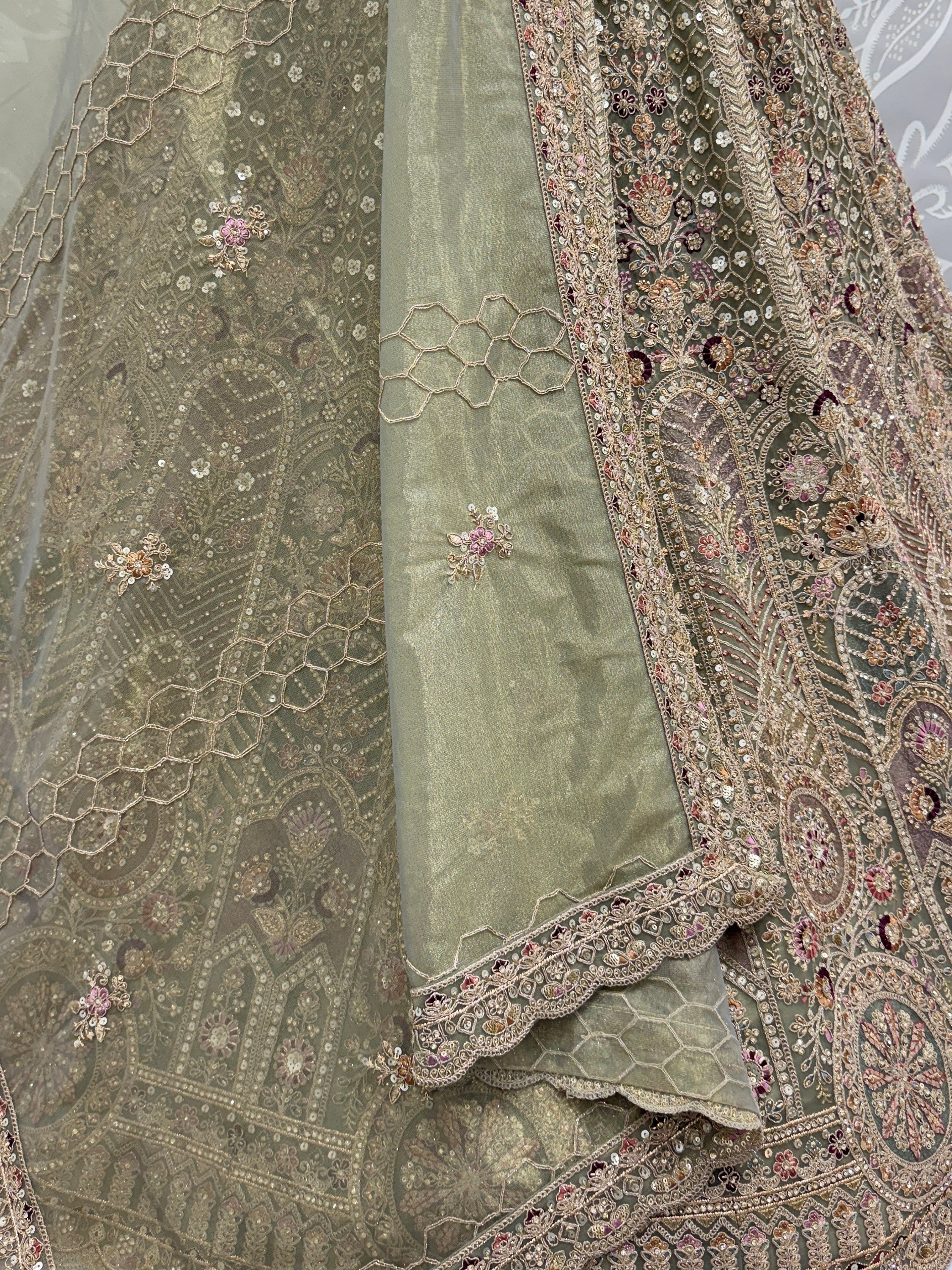 Ravishing Green Heavy Embroidered Net Evening Wear Lehenga Choli