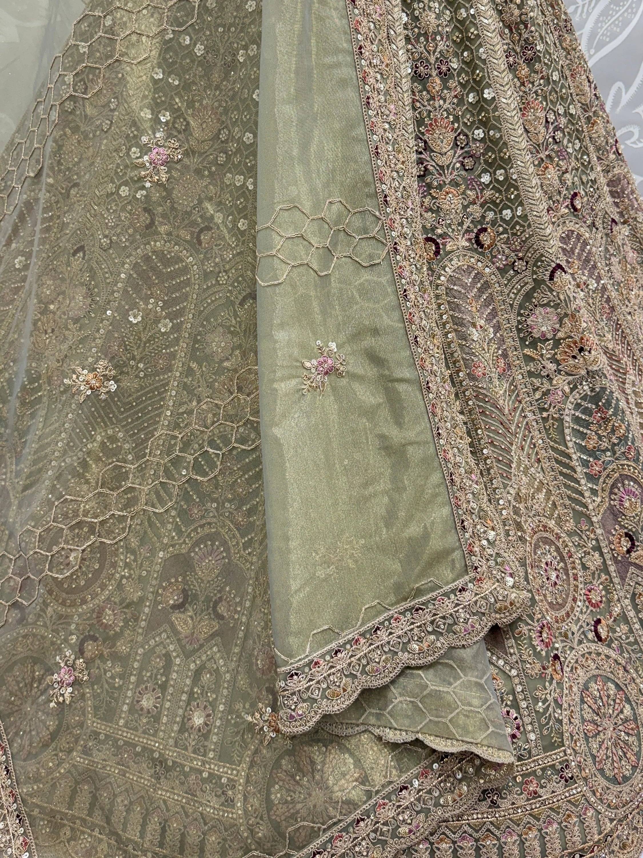 Ravishing Green Heavy Embroidered Net Evening Wear Lehenga Choli