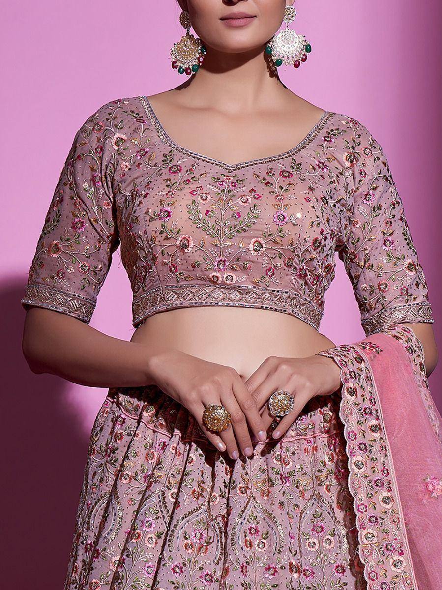Pink floral embroidered lehenga choli with sheer blouse and matching dupatta, ideal for Indian ethnic wear occasions