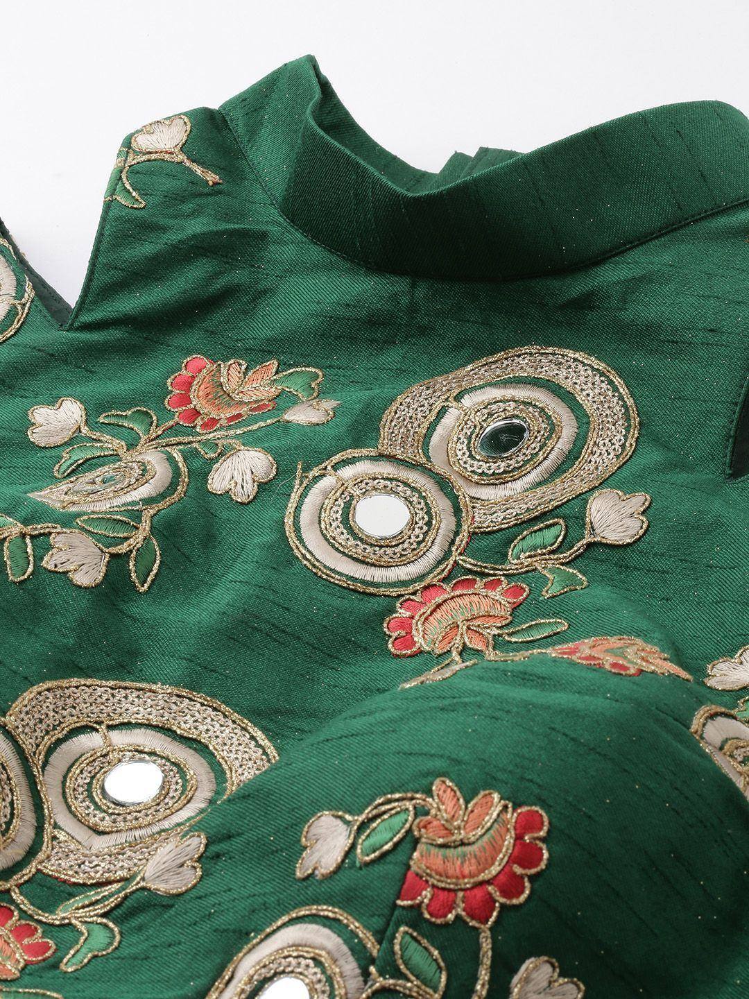 Emerald green ethnic blouse with floral embroidery and mirror work, perfect for Indian wear.