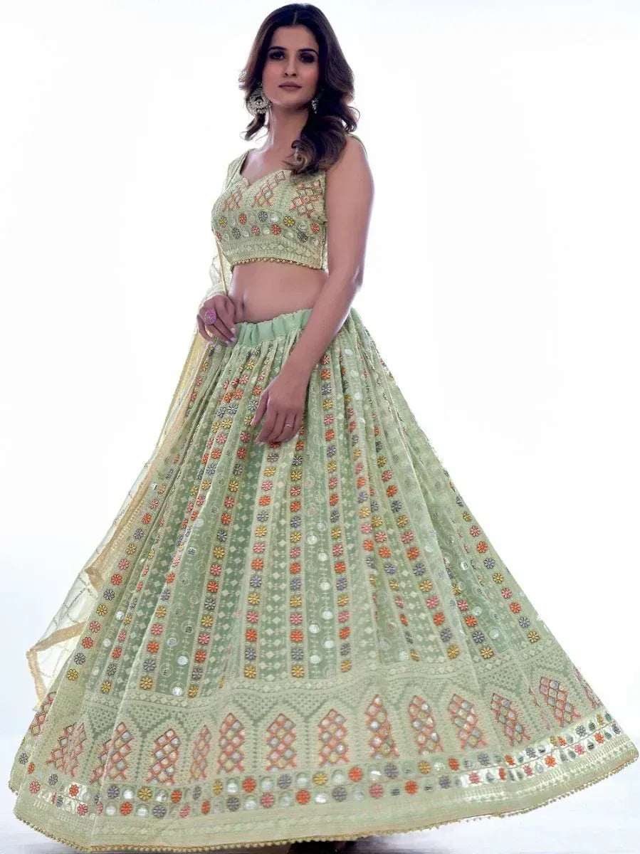 Mint green embroidered lehenga choli with floral mirror work, perfect for Indian ethnic occasions