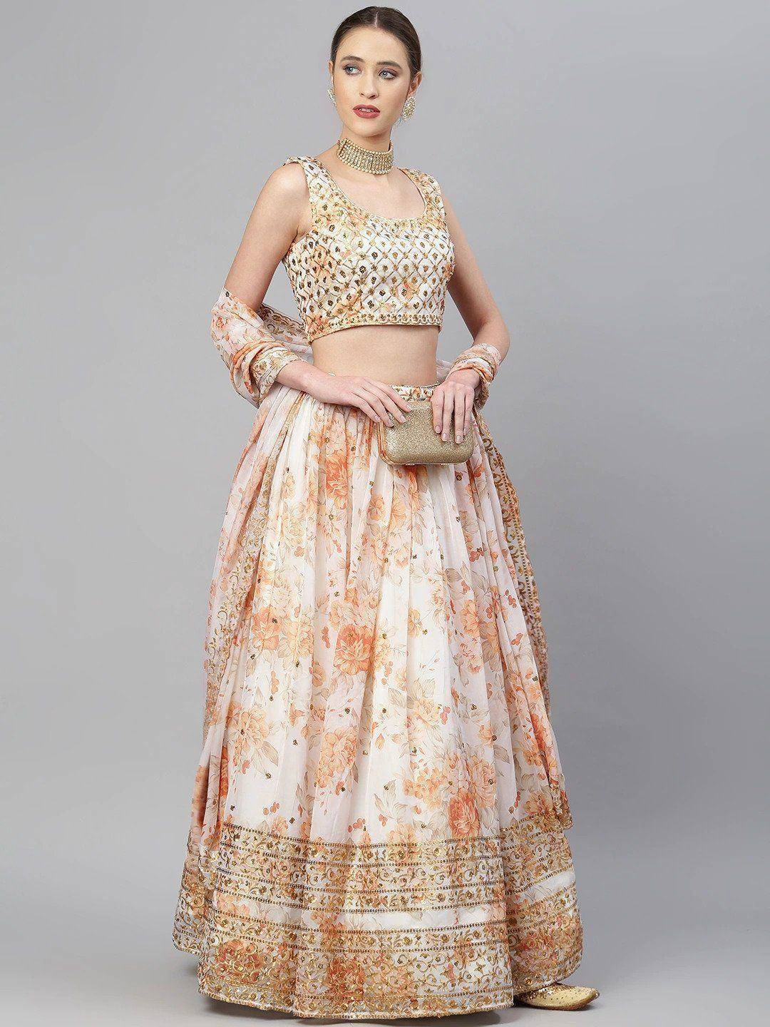 Elegant peach floral lehenga choli with gold embroidery, perfect for Indian weddings and festive occasions